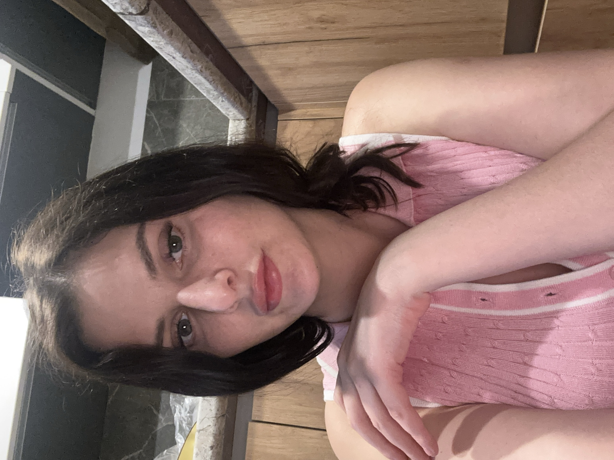 Casual self-portraits at home with a cat nearby