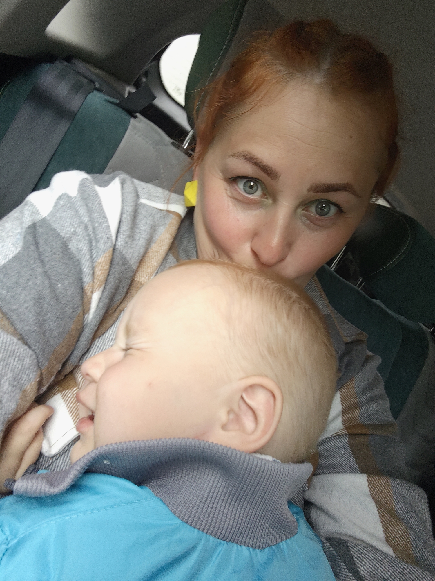 Woman and baby photographed inside vehicle in Chaikovsky, Russia