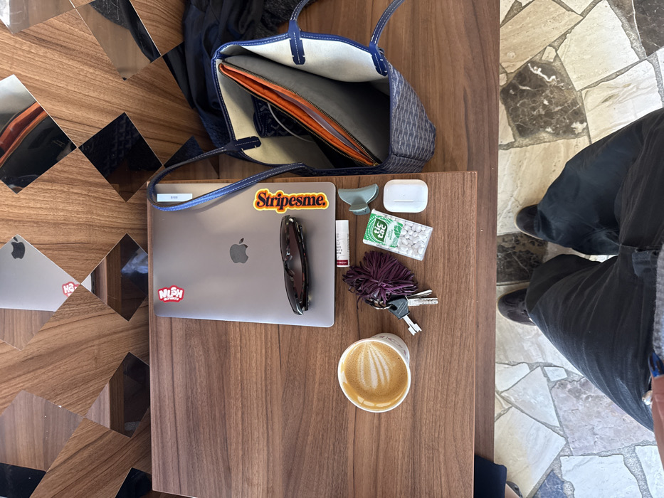 Woman enjoys coffee at Parisian cafe near Rue Saint-Honoré