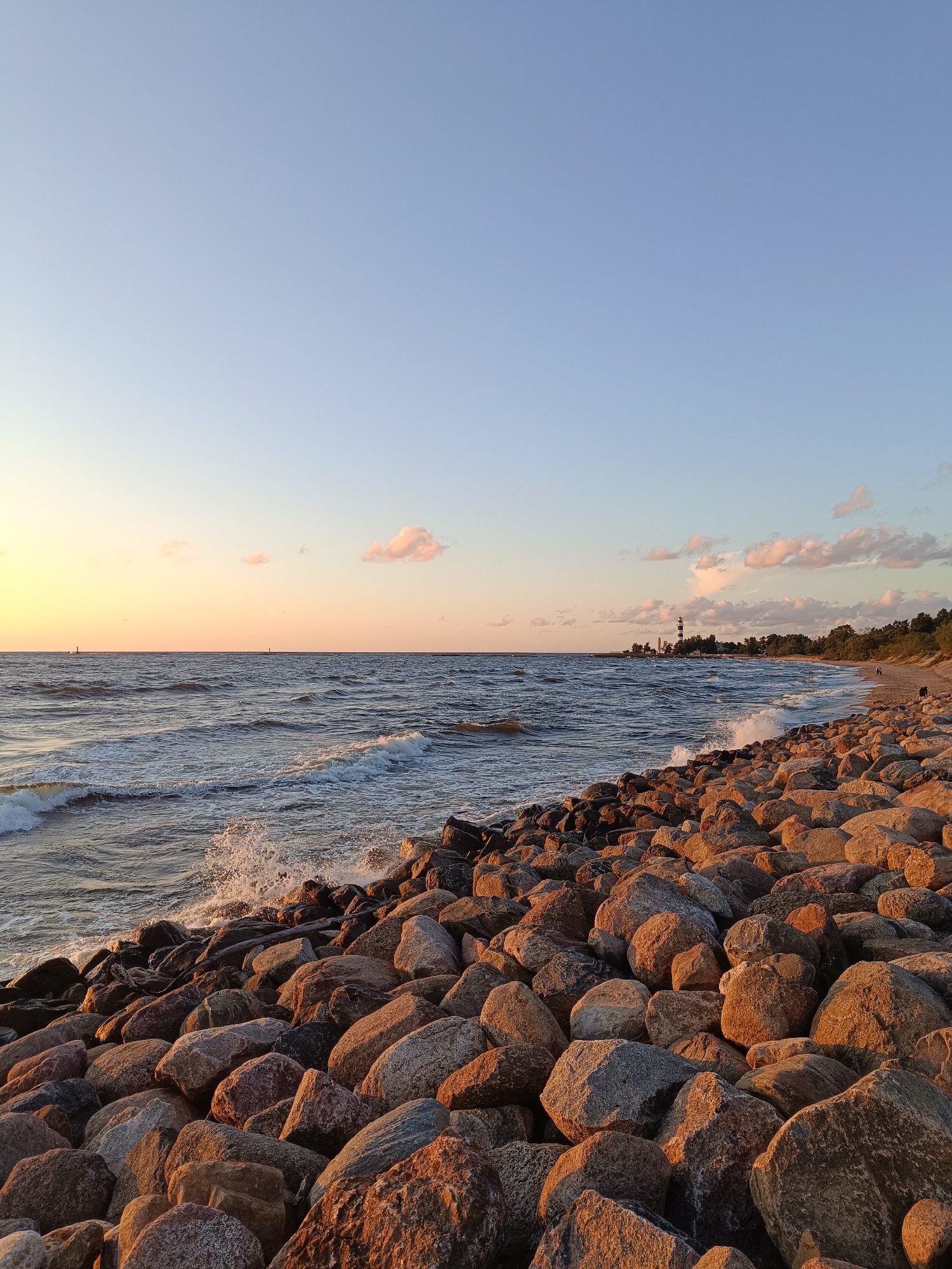 Golden hour on the Baltic, rocky Riga shoreline at sunset