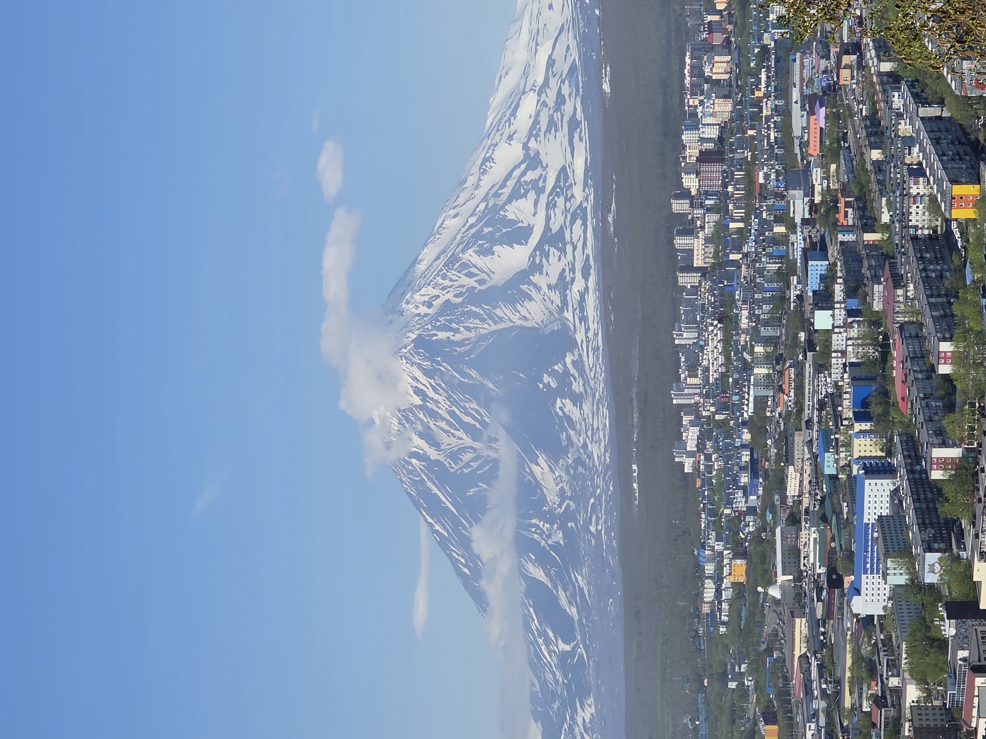 City witnesses capture morning views of snow-capped volcanic peaks