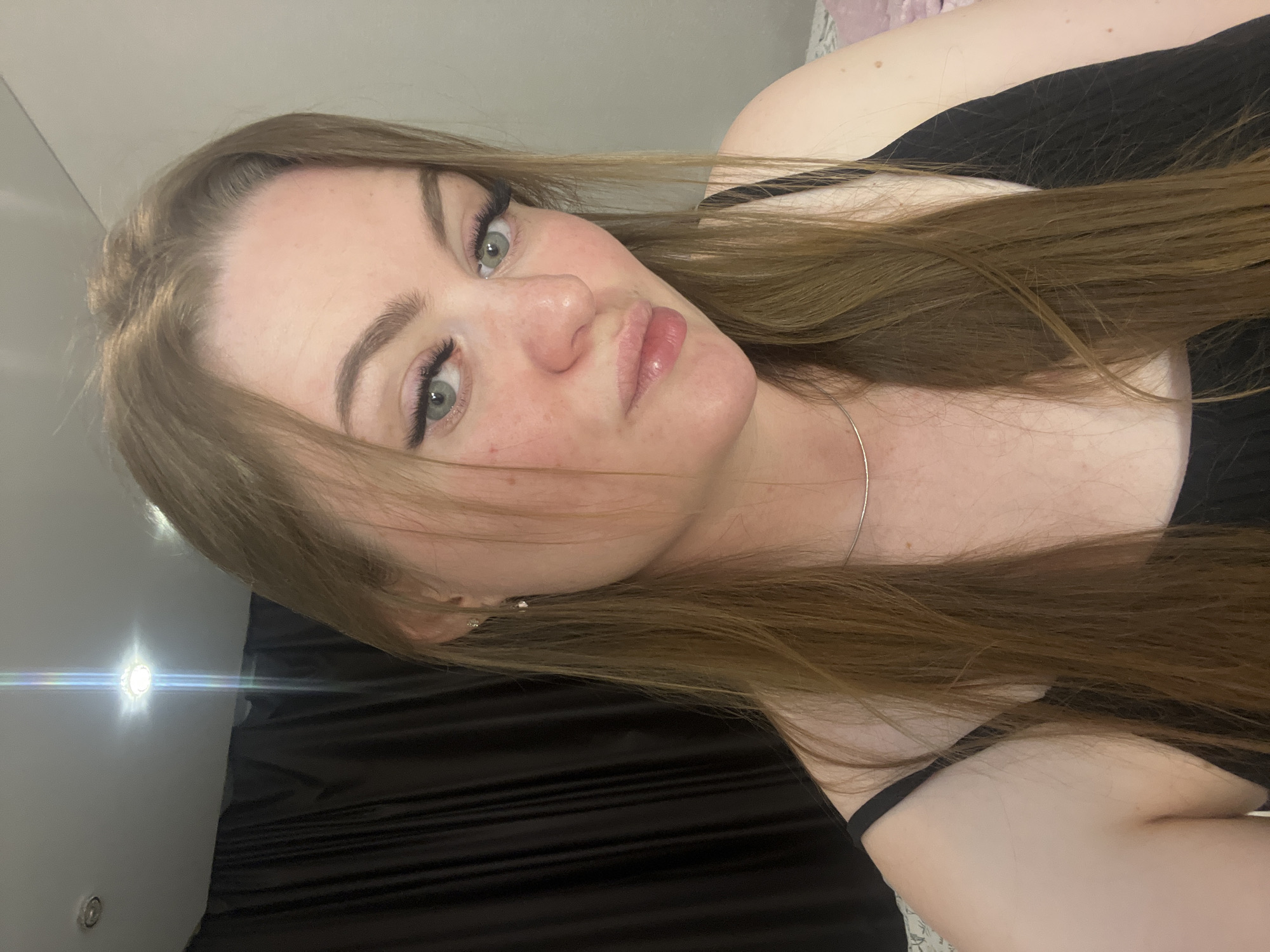 Woman documents evening selfie session in Sevastopol residence