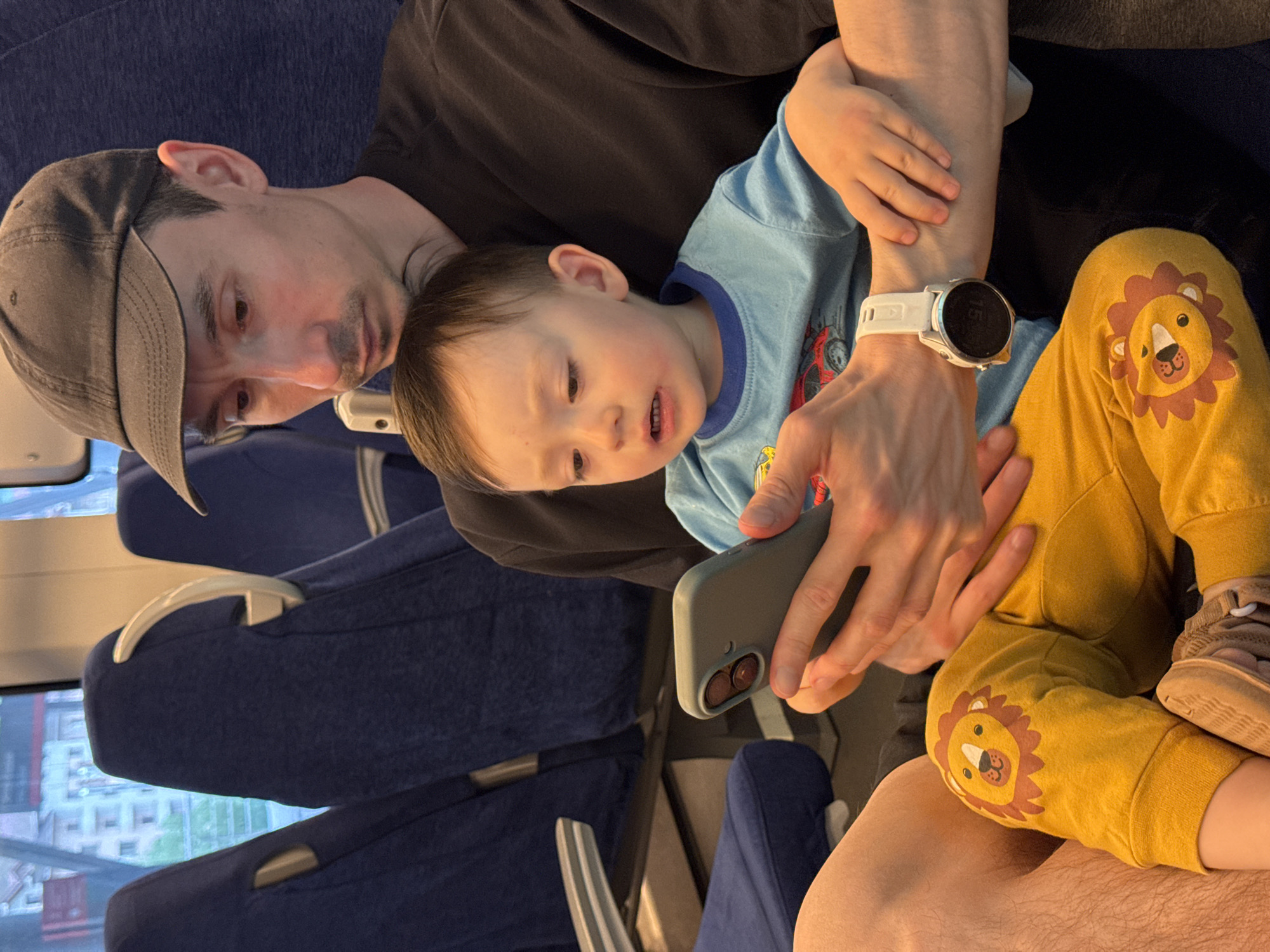 Man and child travel by train in Estosadok