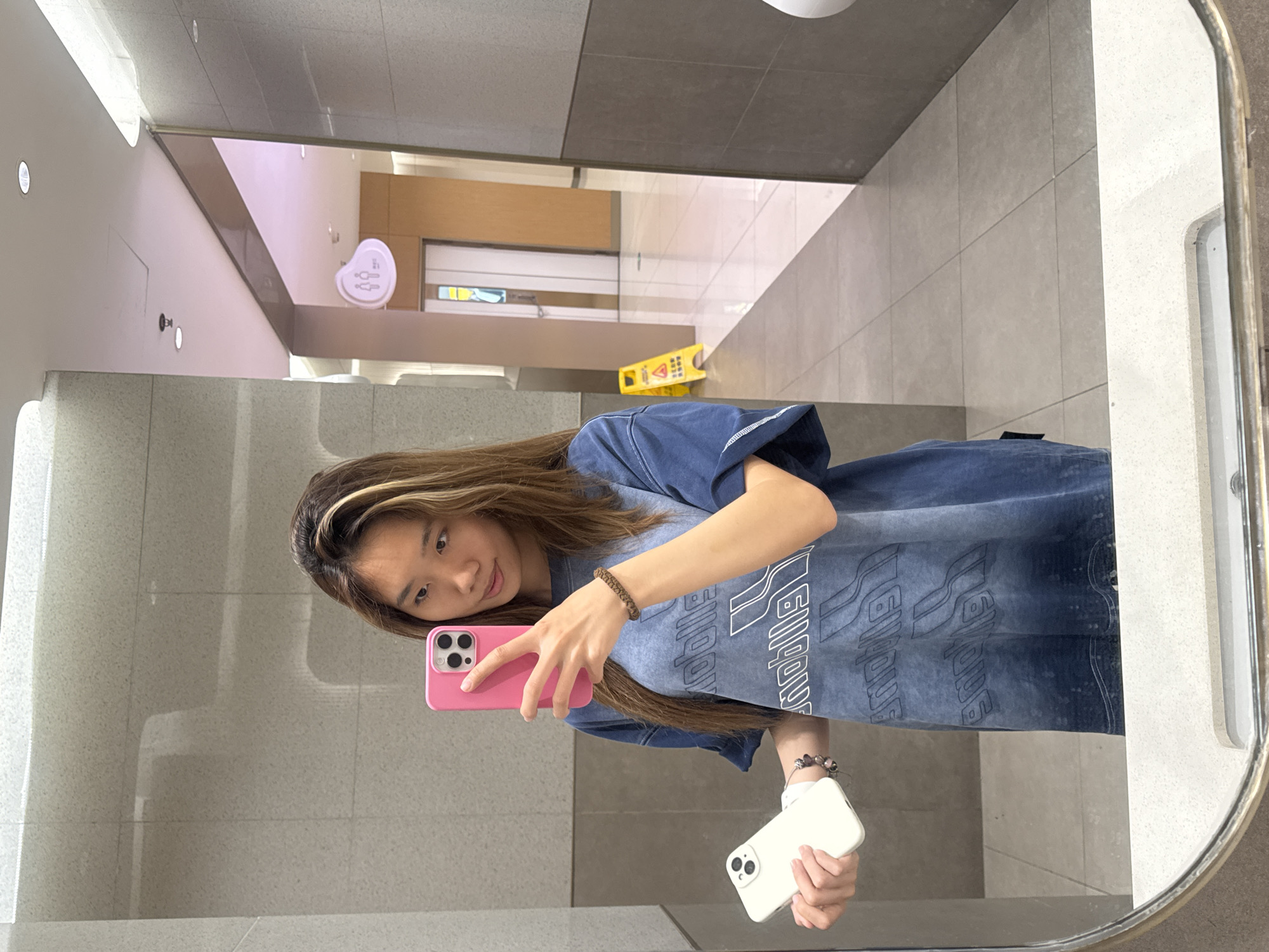 Woman takes selfie in Shapingba District public restroom