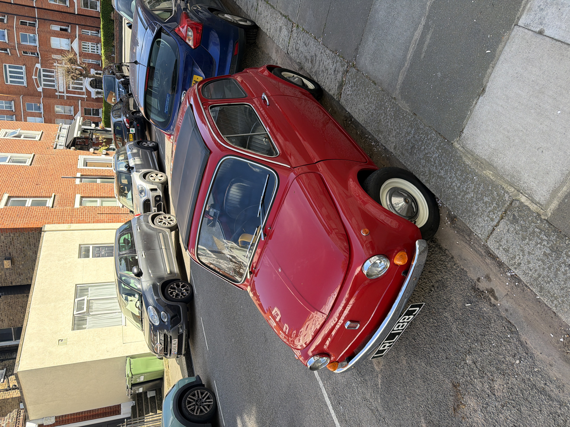 Vintage red car spotted parked on London street