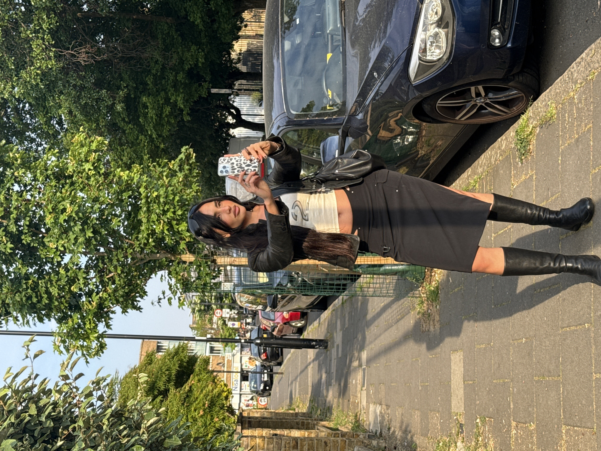 Women in black leather jackets photographed on London street