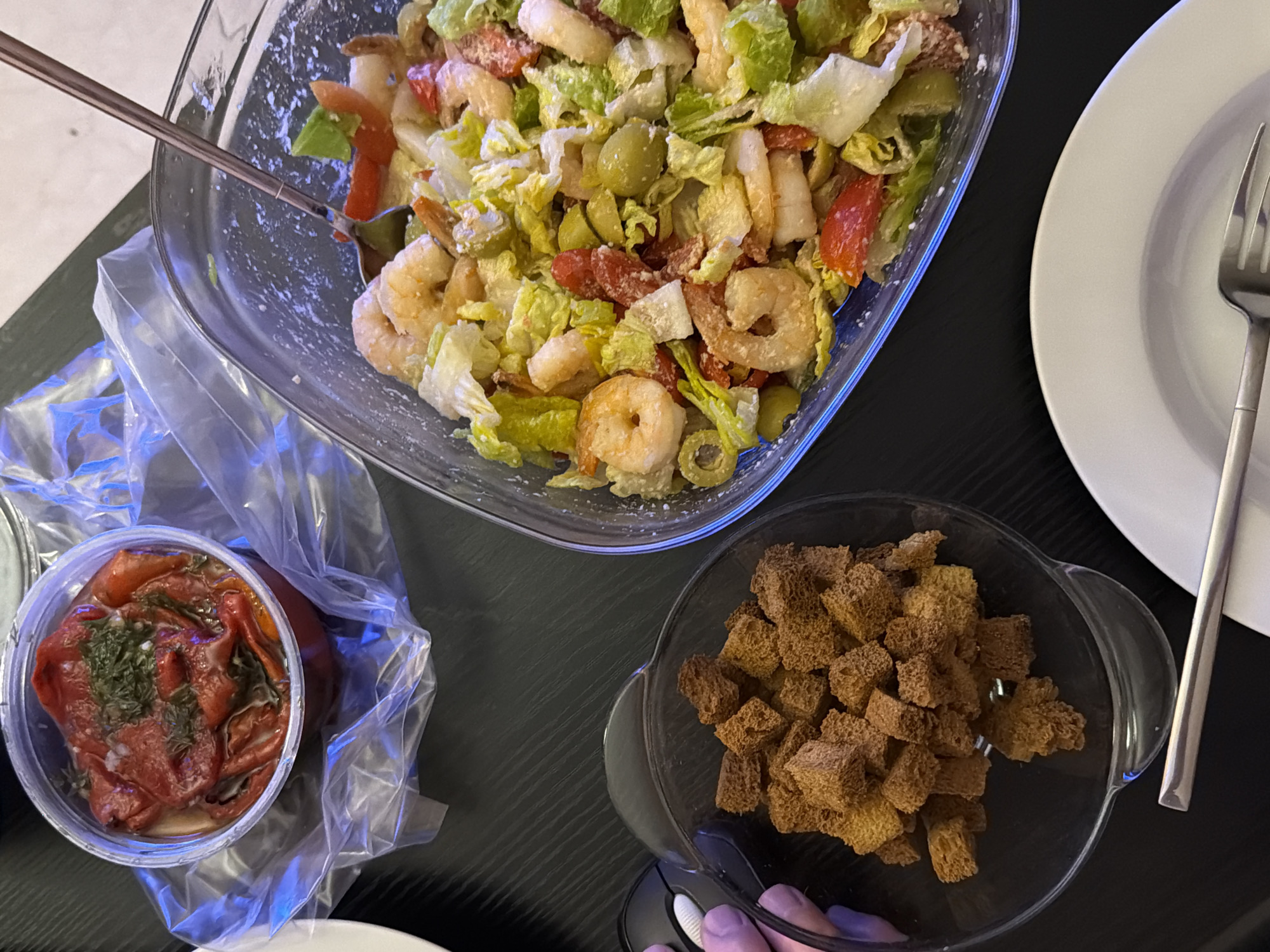 Casual shrimp salad meal documented in Tel Aviv
