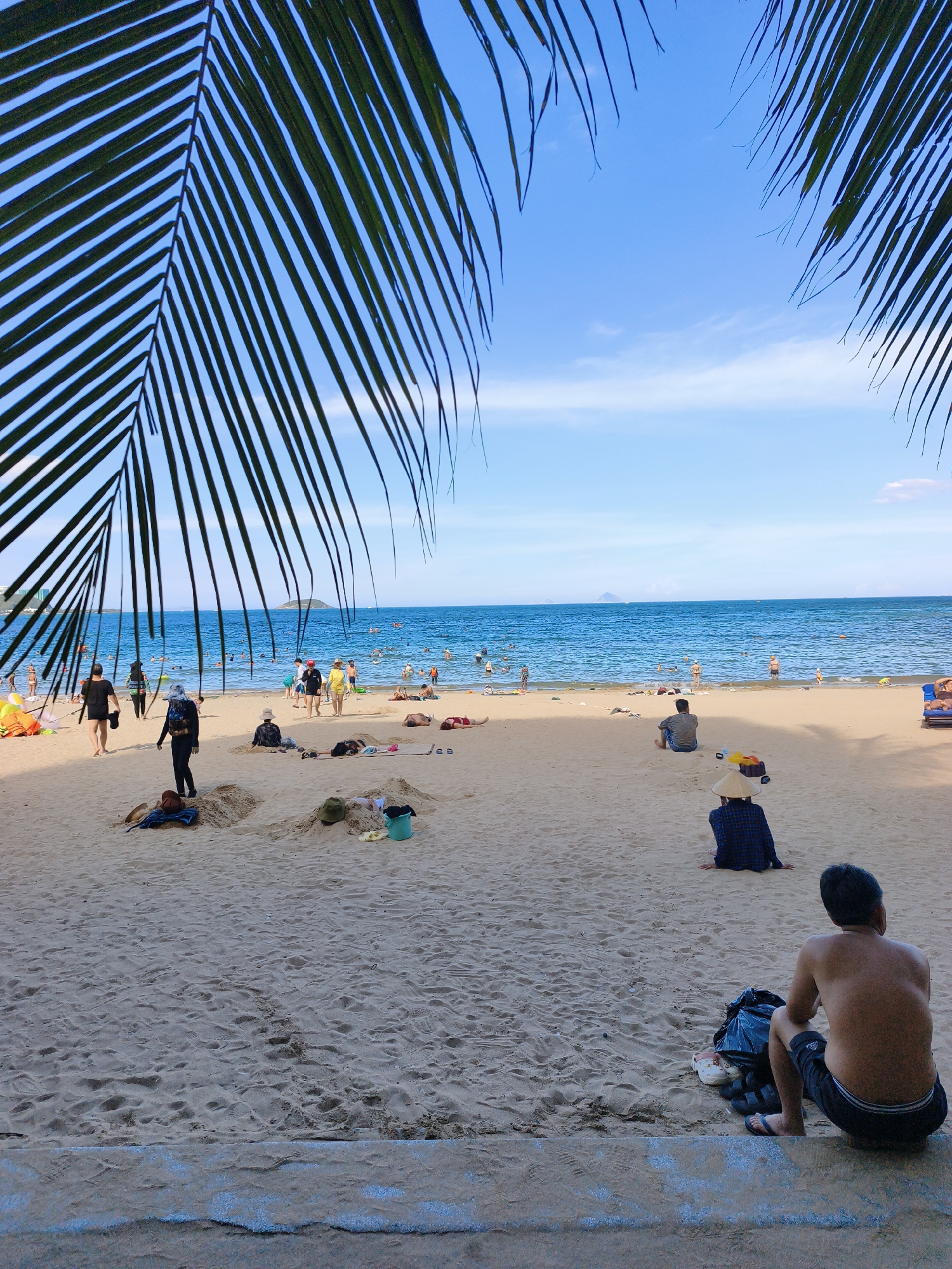 Busy beach day along Nha Trang's central coastline