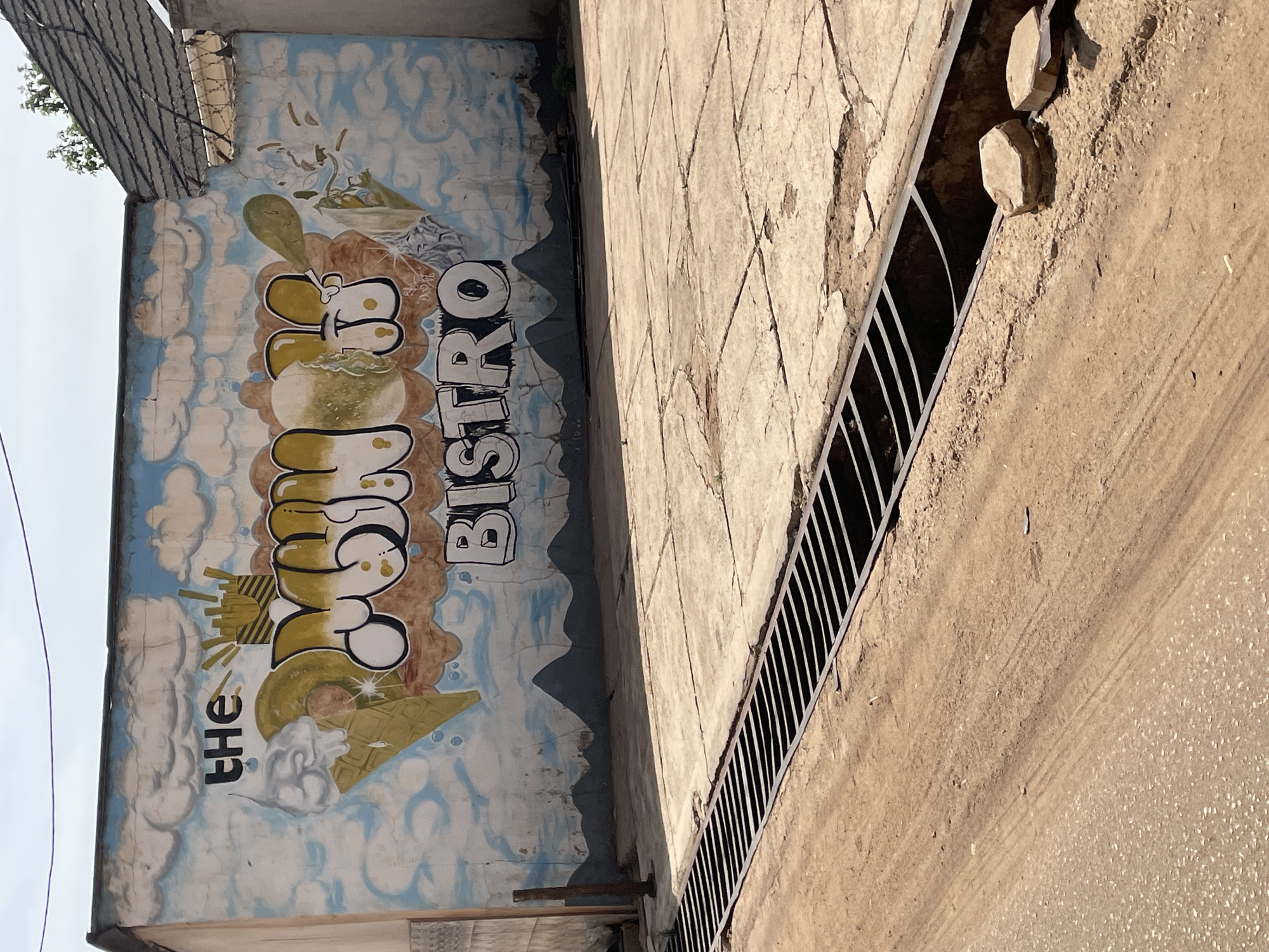 Street art mural spotted at Cookie Bistro in Jos