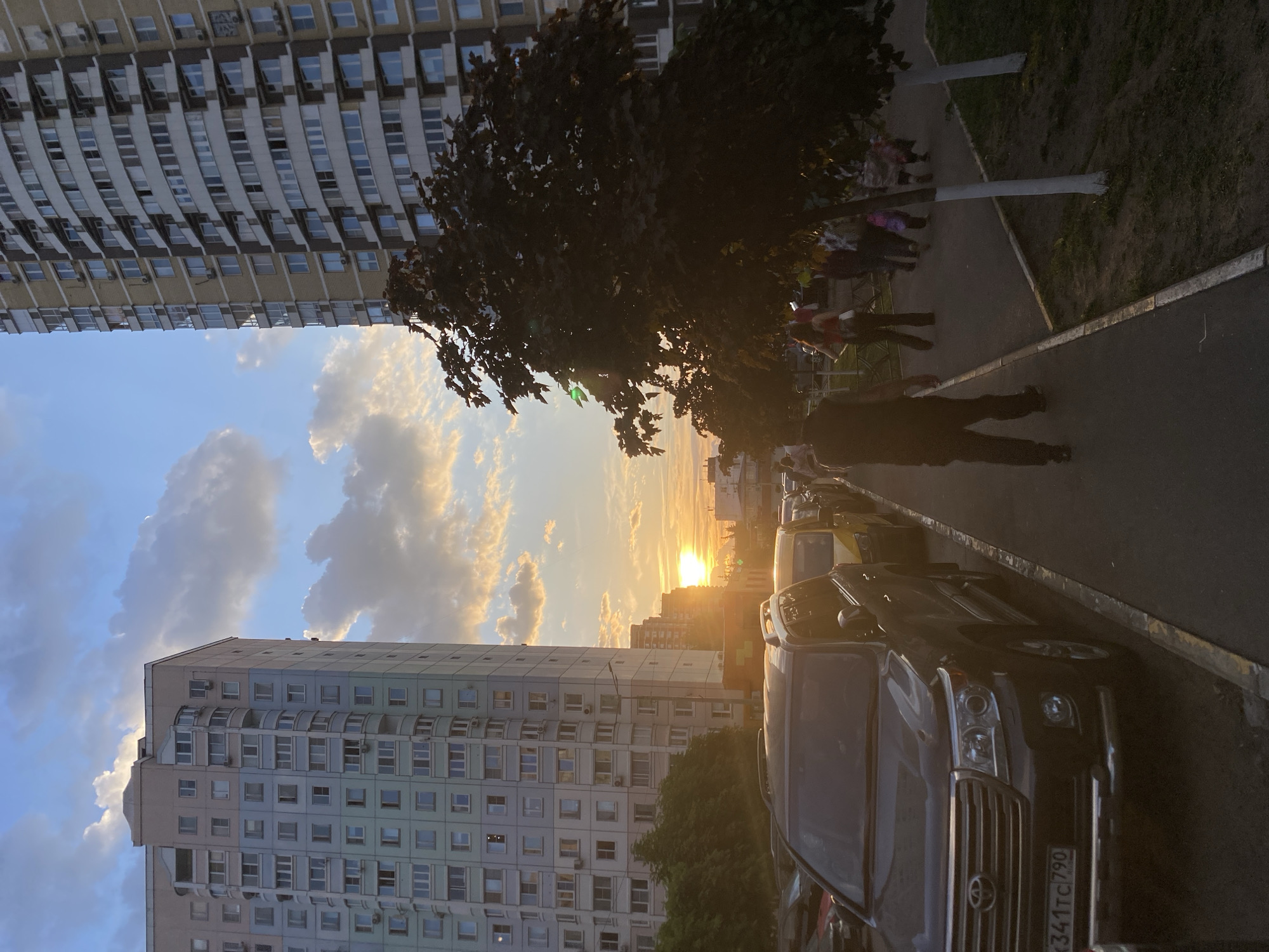 Sunset street scene with residential buildings captured by witness