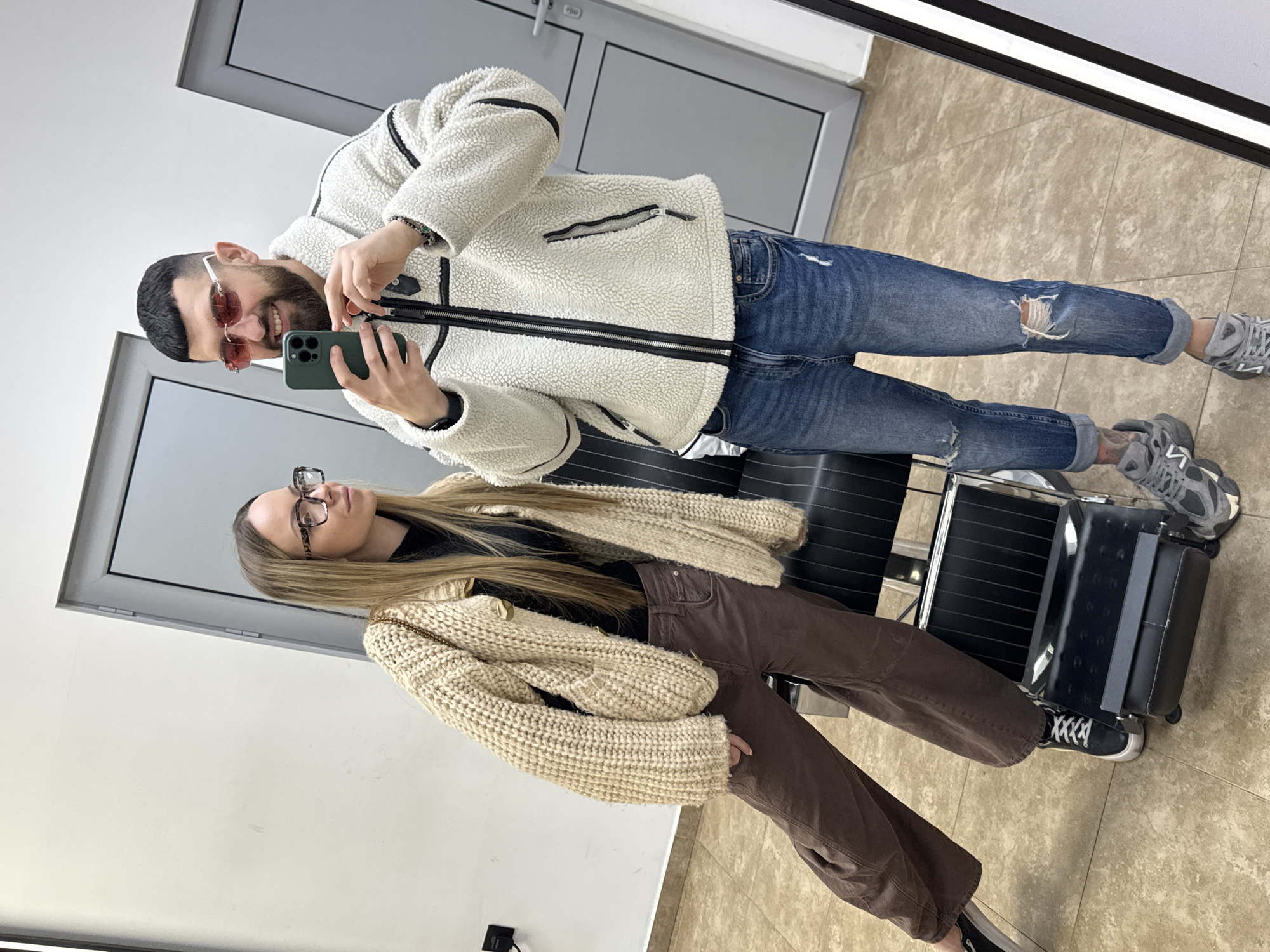 Couple takes mirror selfies at salon in Kazanlak