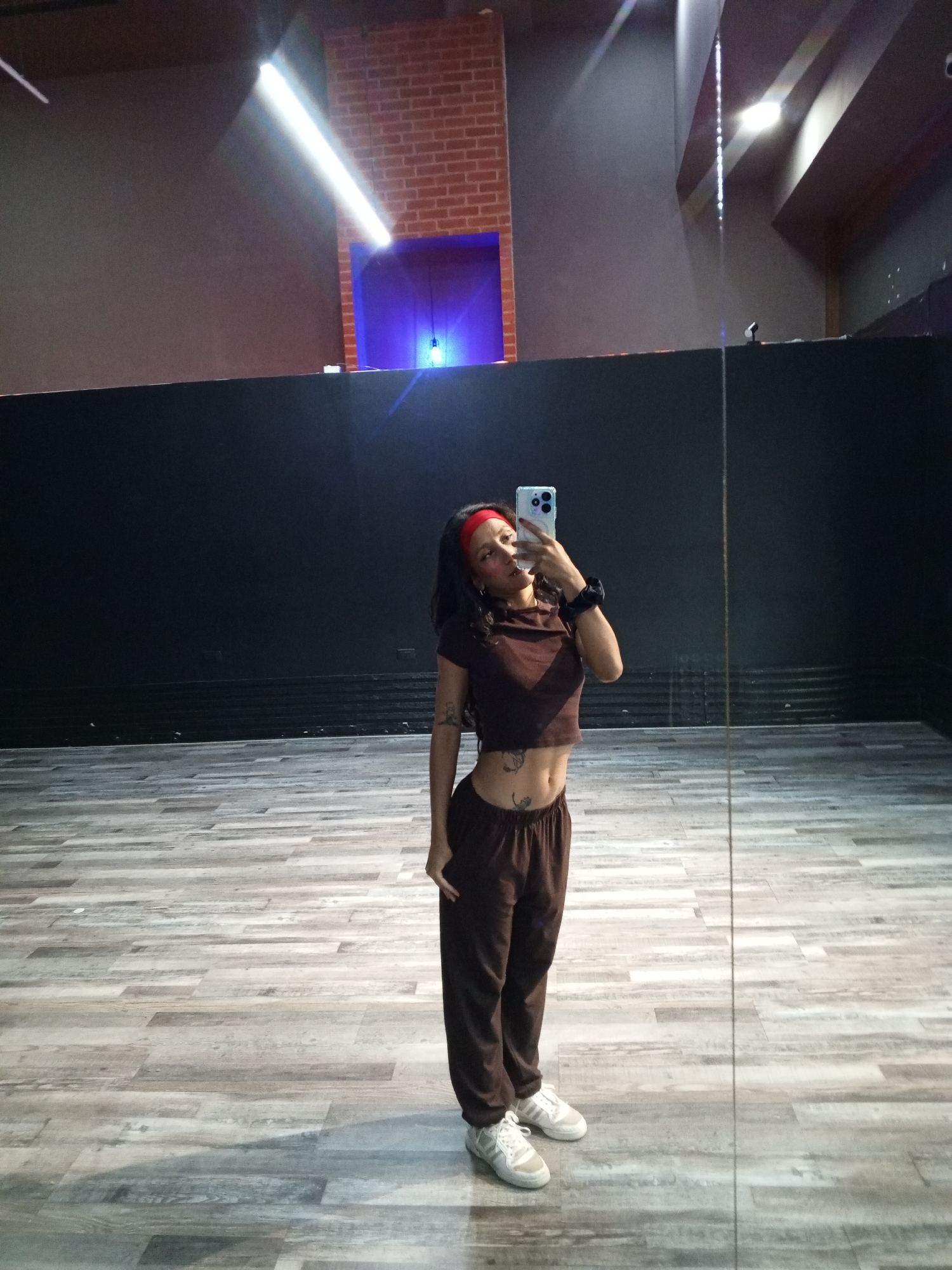 Woman records selfie content at Pampatar fitness studio