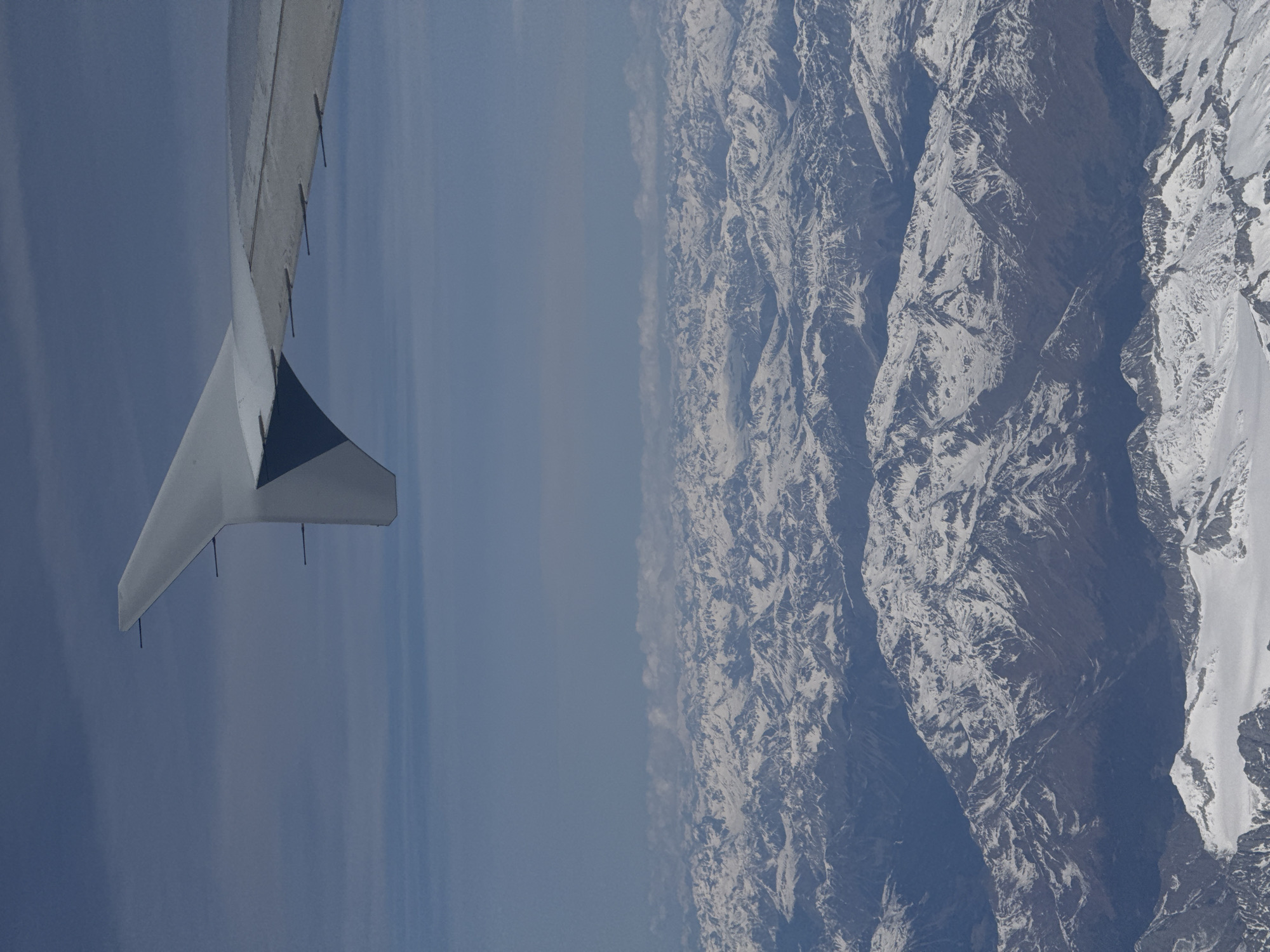 Aerial view of snow-covered mountains captured over northern Italy