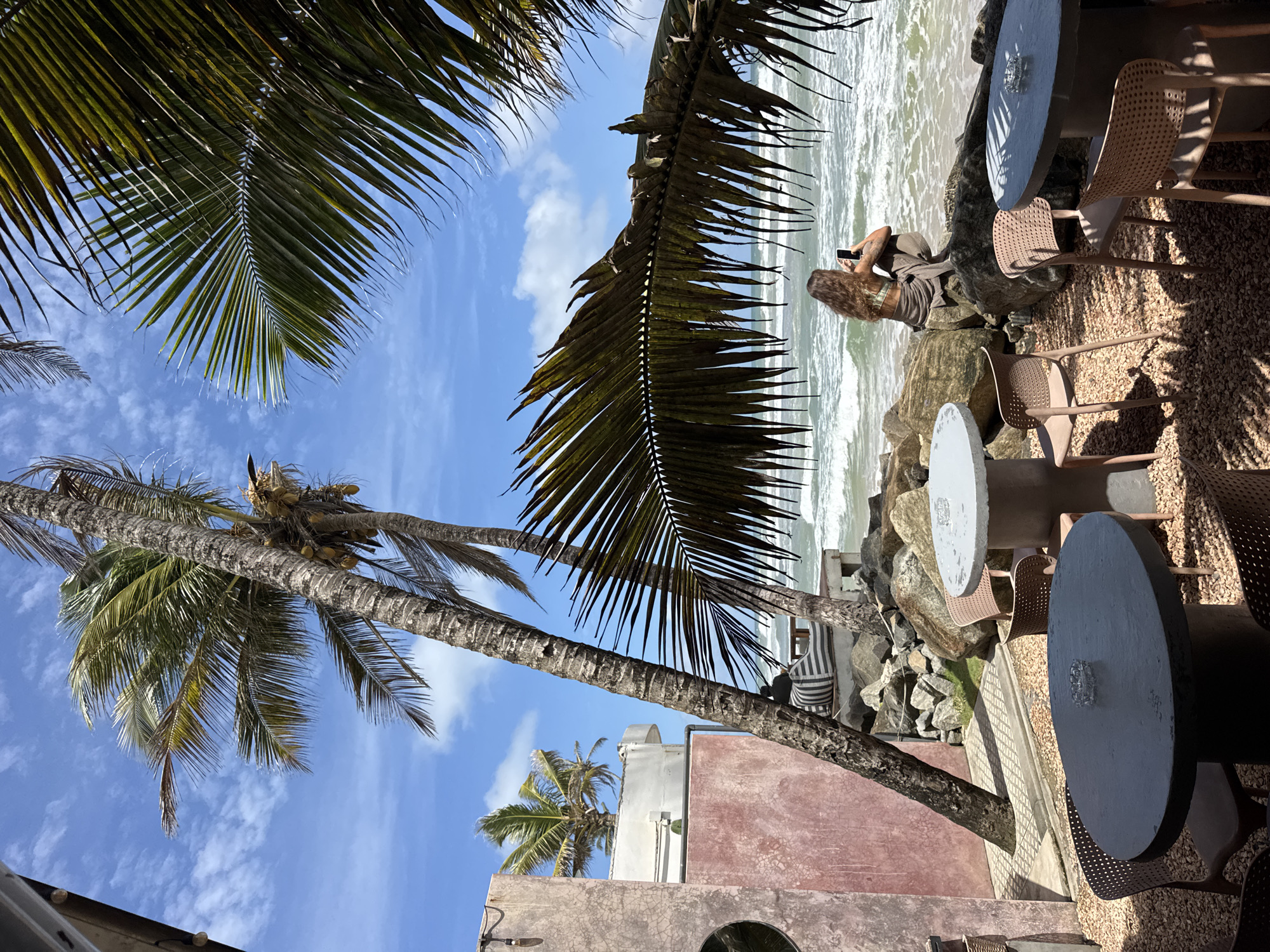 Beachfront café morning in Ahangama, rocks and ocean views