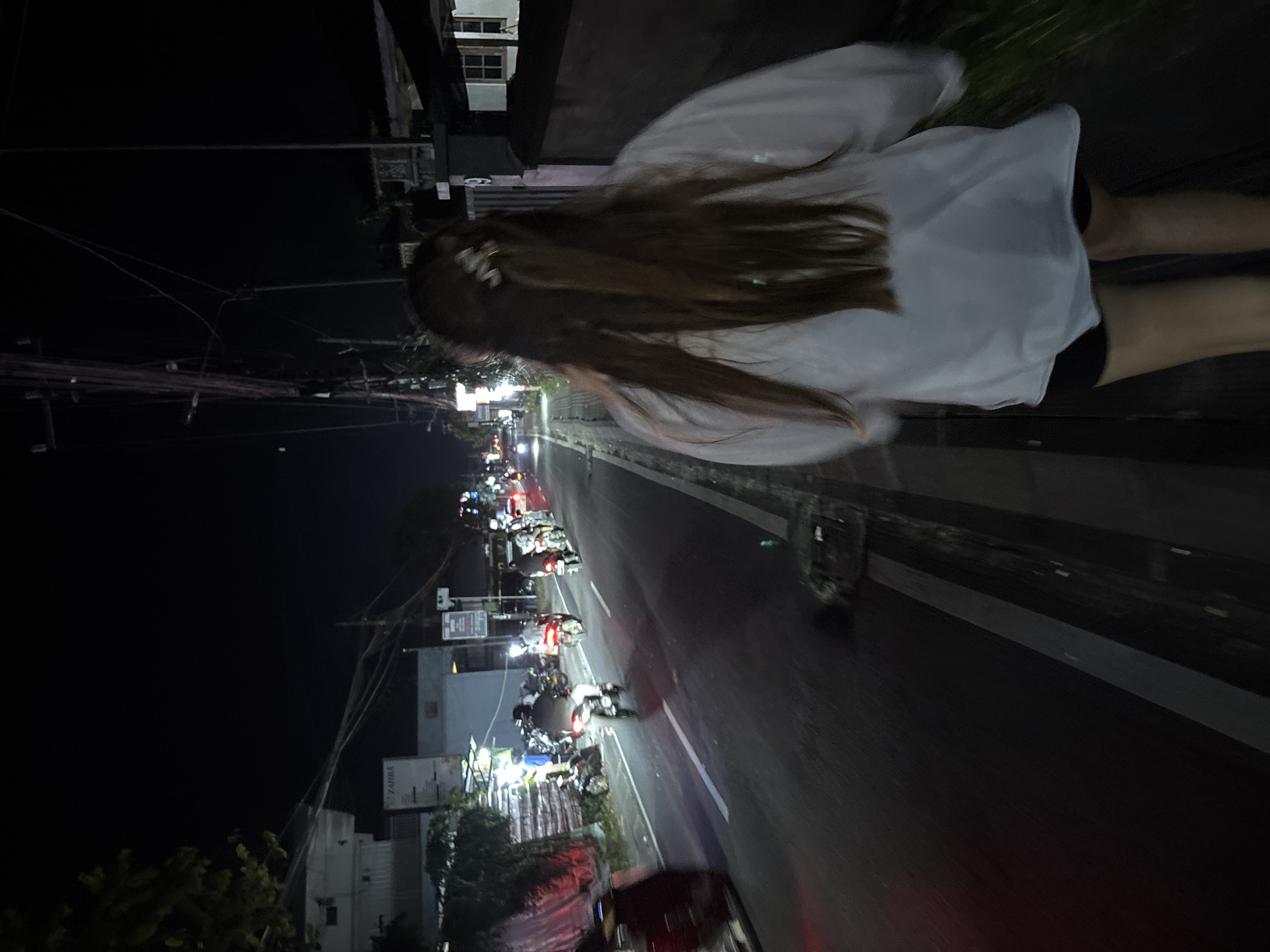 Person walks along street in Ungasan, Indonesia
