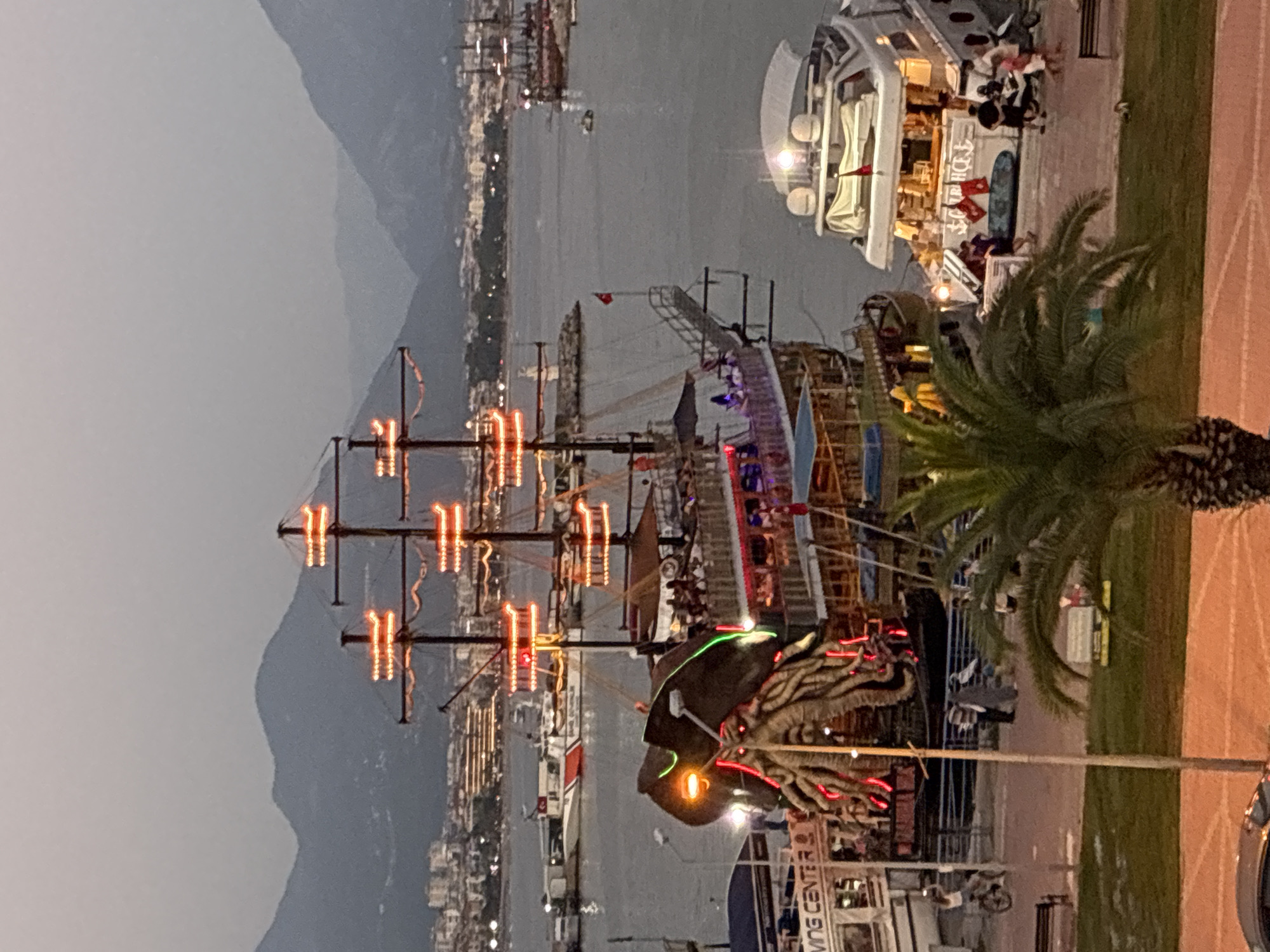 Alanya harbor at dusk: pirate ships, promenades, and street life