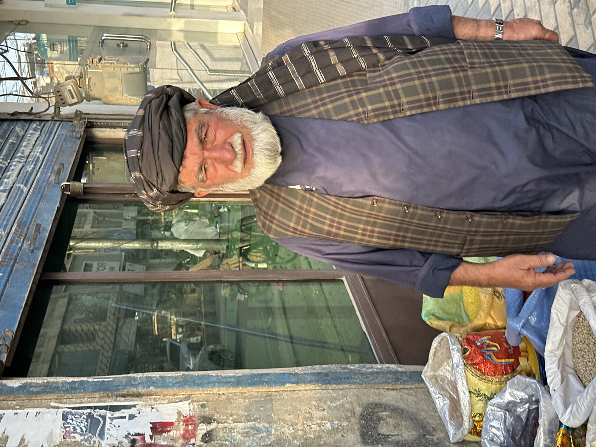 Outside a Quetta storefront, bags and goods on display