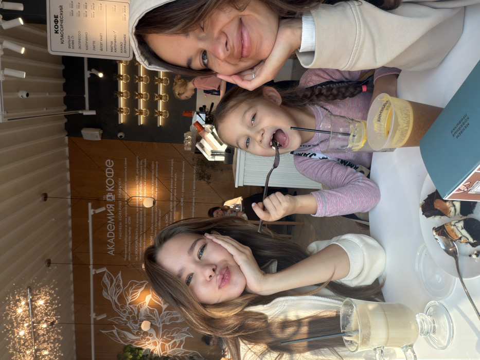 Teen and child share morning cafe visit in Krasnoyarsk