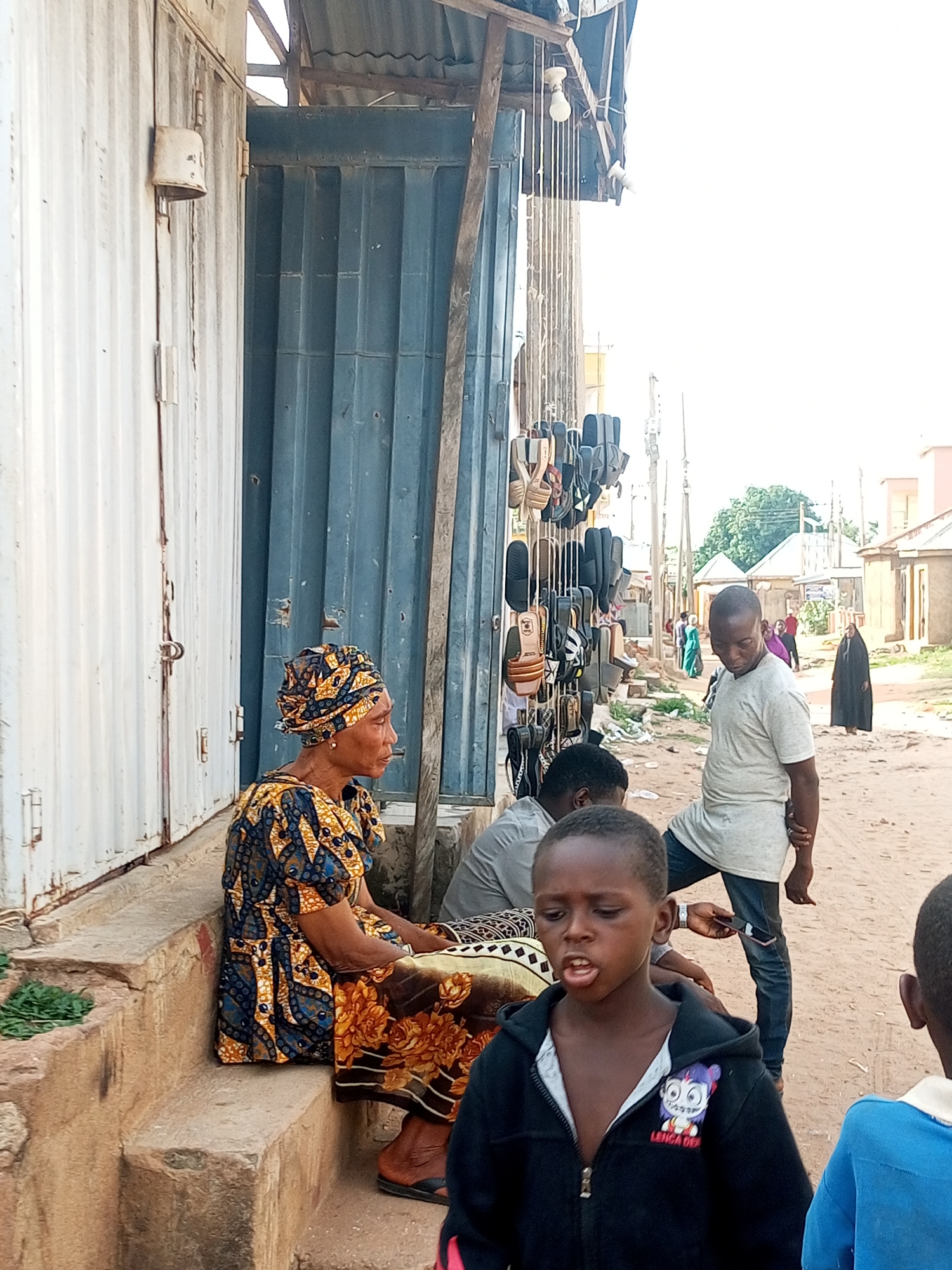 Midday street and market life across small-town northeastern Nigeria