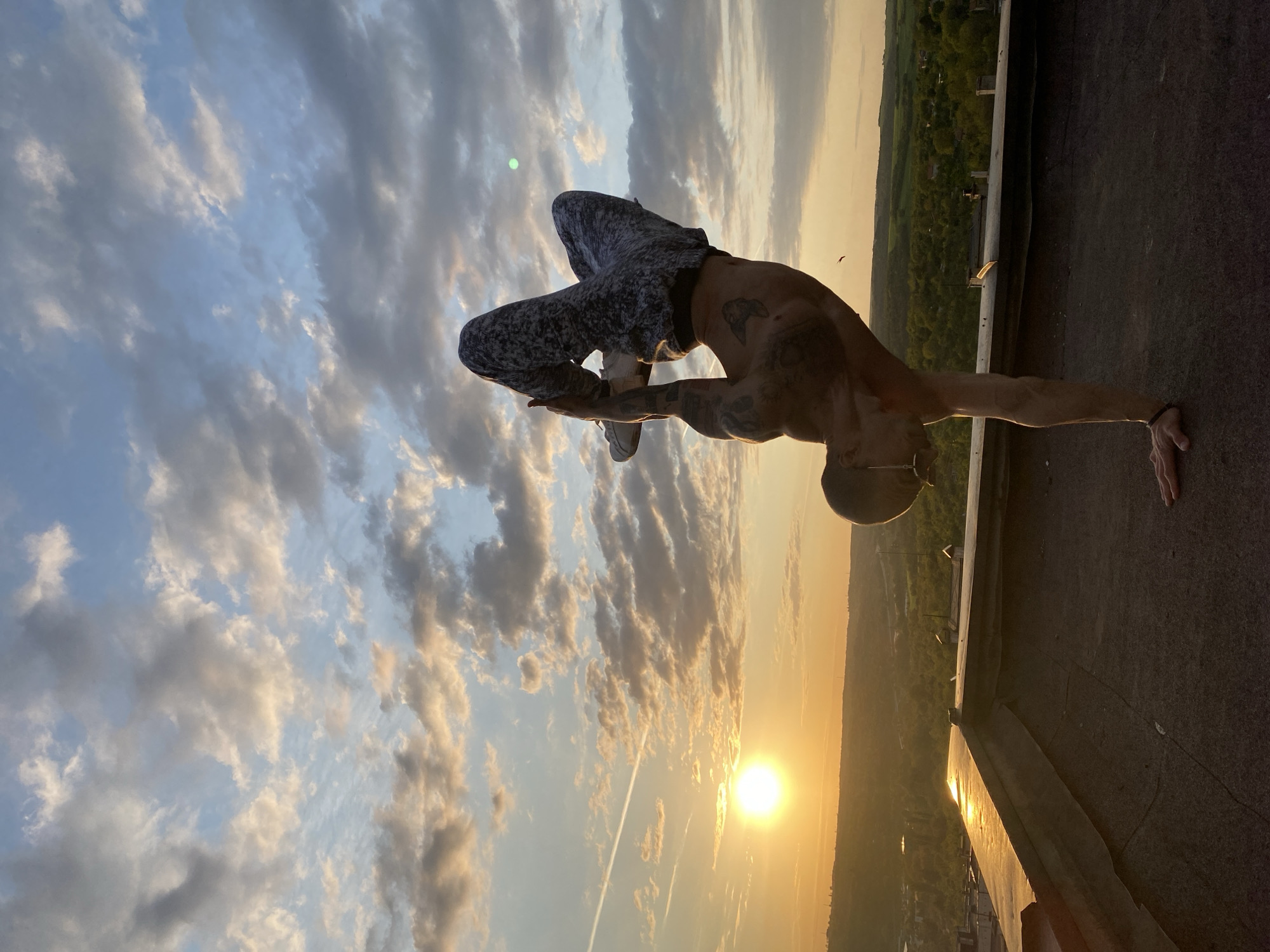 Acrobatic rooftop performance captured at sunset in Pleven, Bulgaria