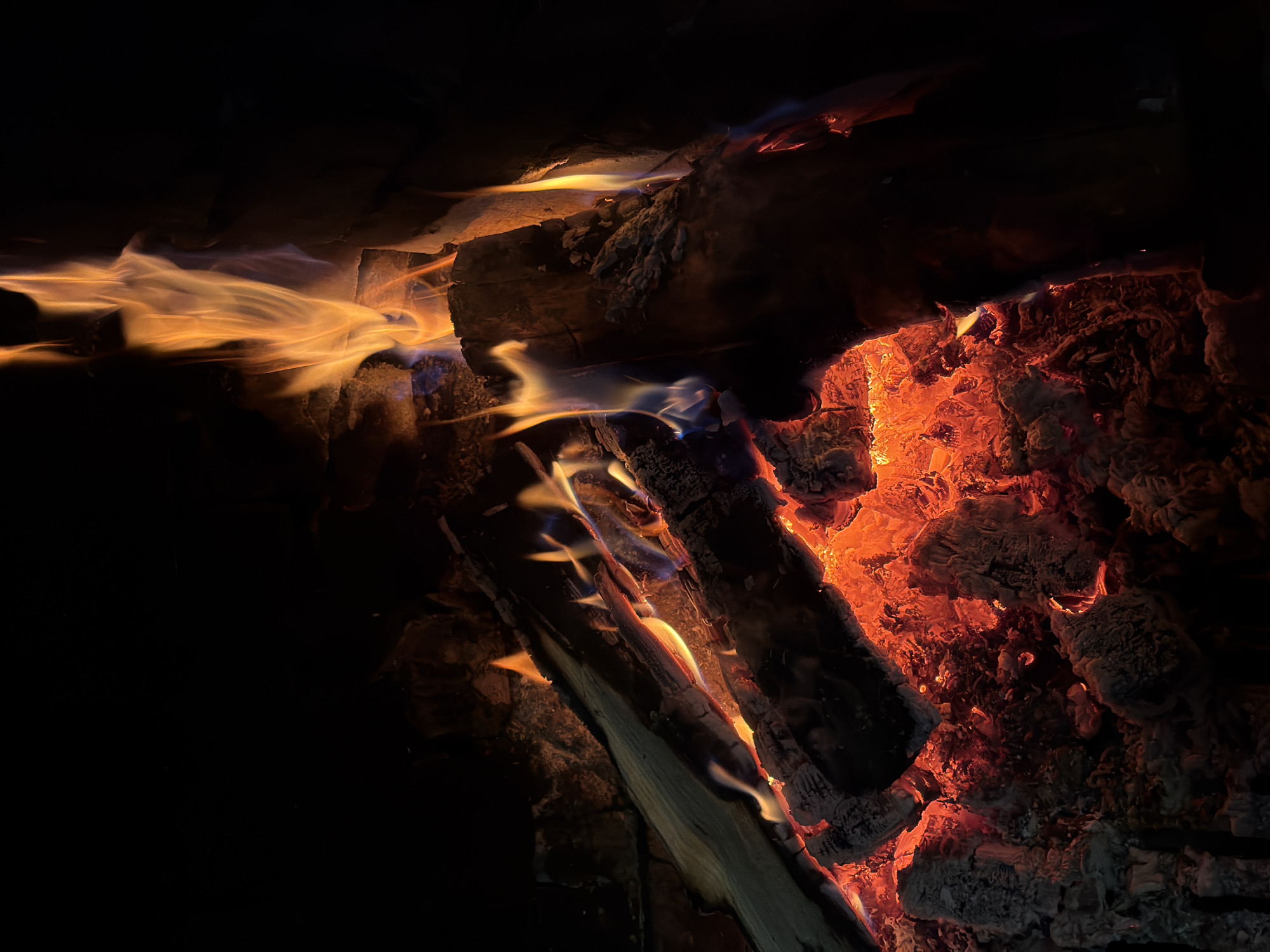 Visitor documents church, fire pit during afternoon in Lilkovo