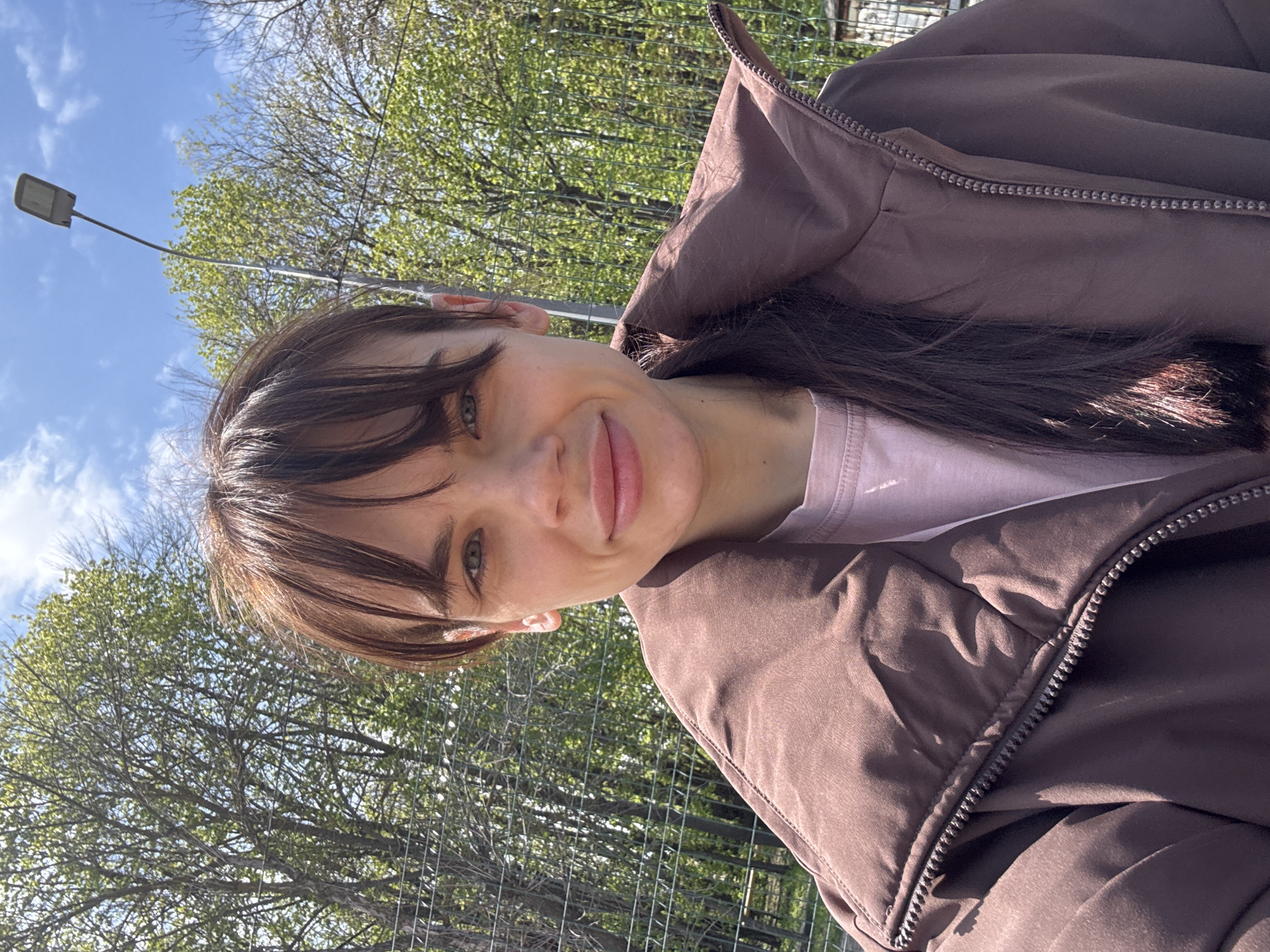 Woman takes selfies in sunny Rostov-on-Don morning