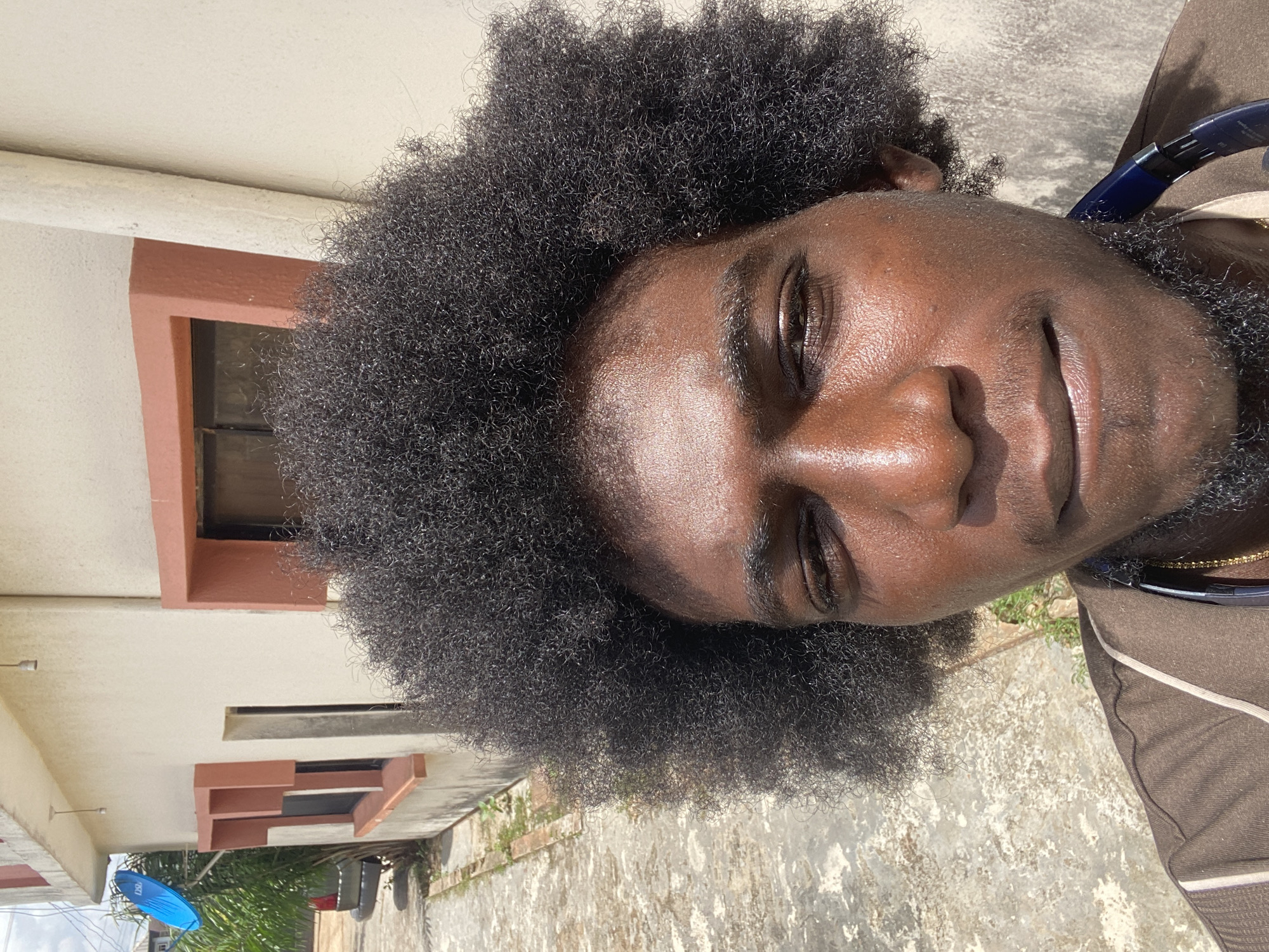Man photographed smoking and relaxing outdoors in Lagos