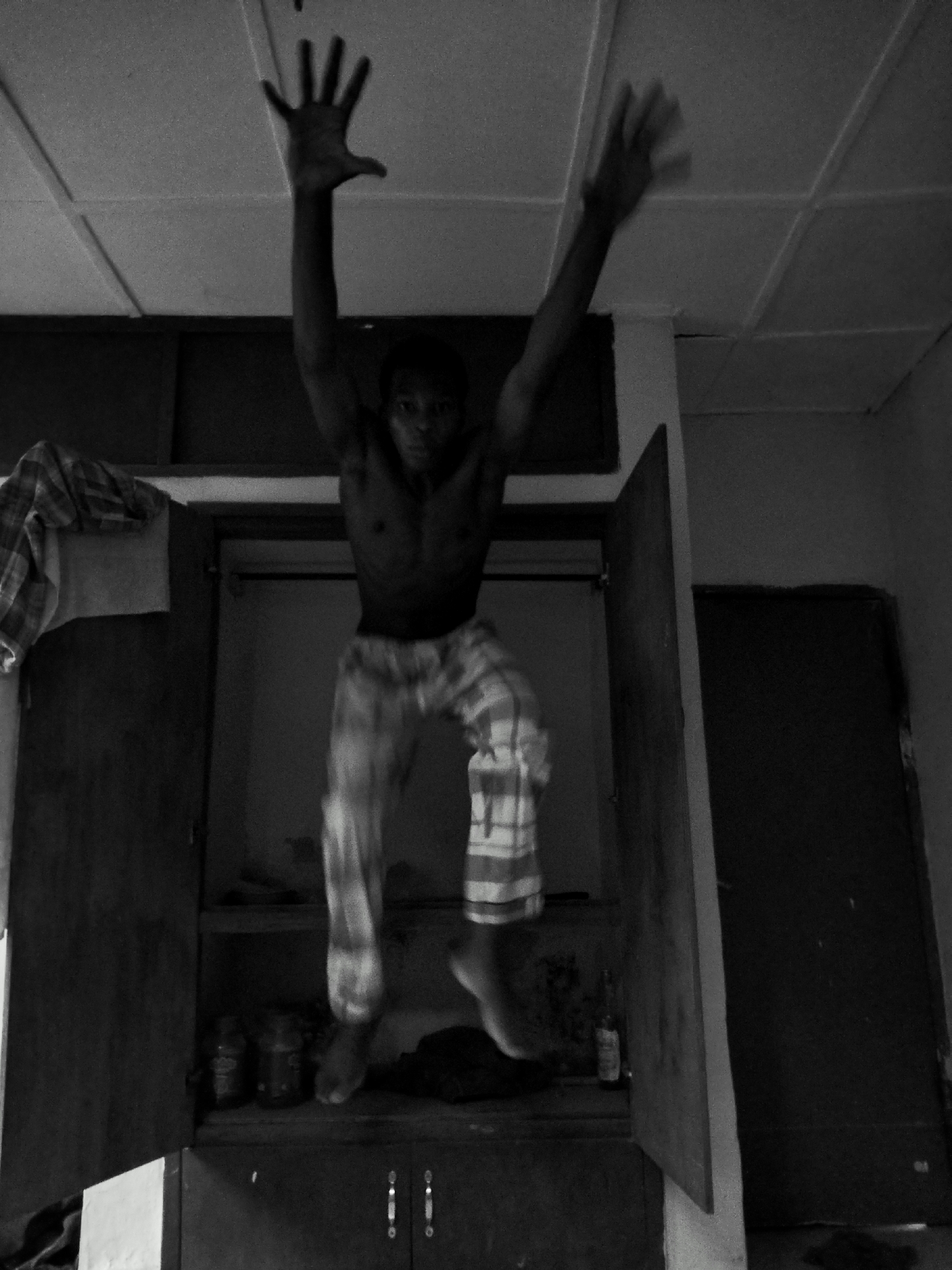 Man exercises indoors during morning workout session in Kubwa