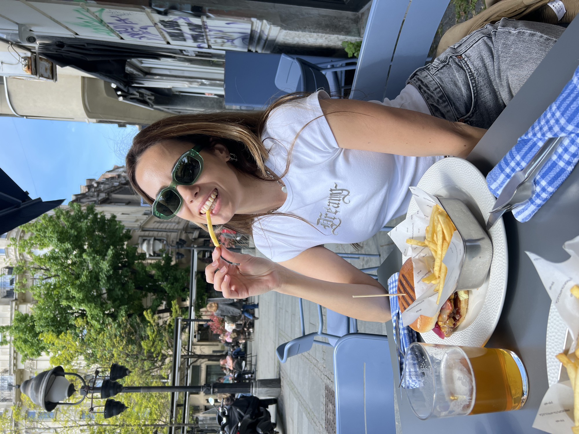 Woman enjoys outdoor dining in Belgrade on Friday morning