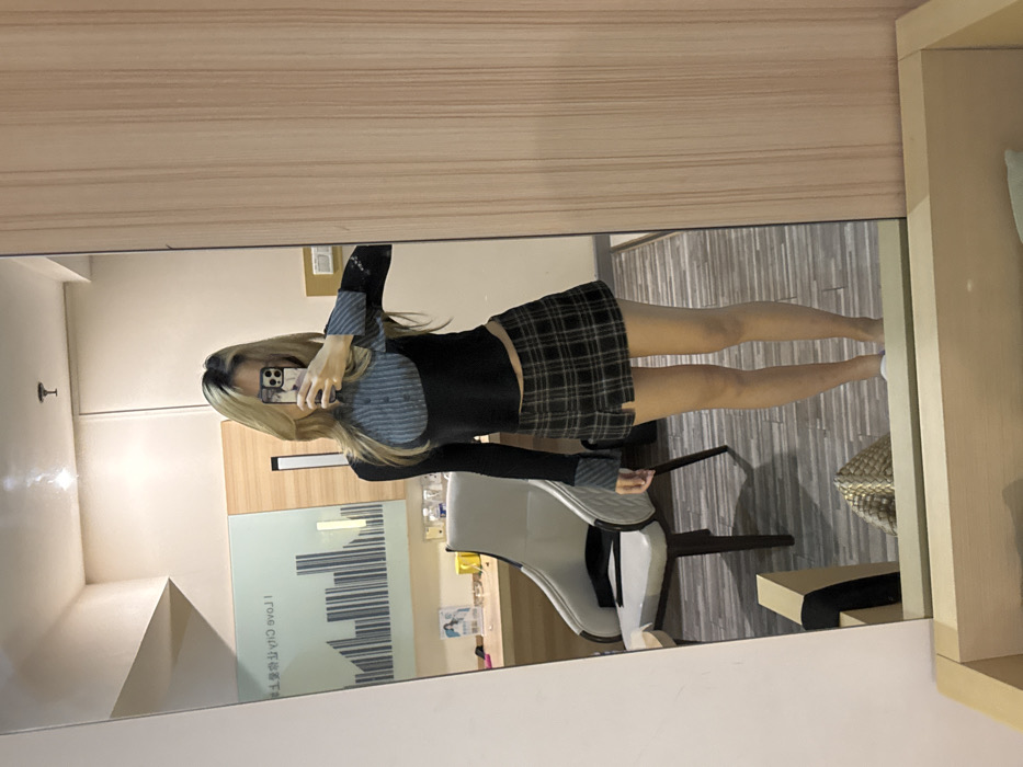 Woman takes mirror selfies in Chongqing hotel room