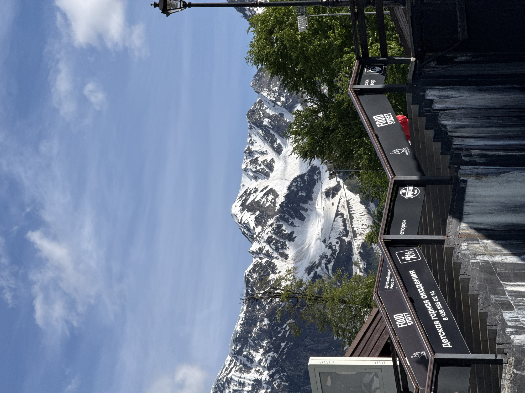 Tourist captures Olympic landmarks and mountain scenery in Estosadok resort