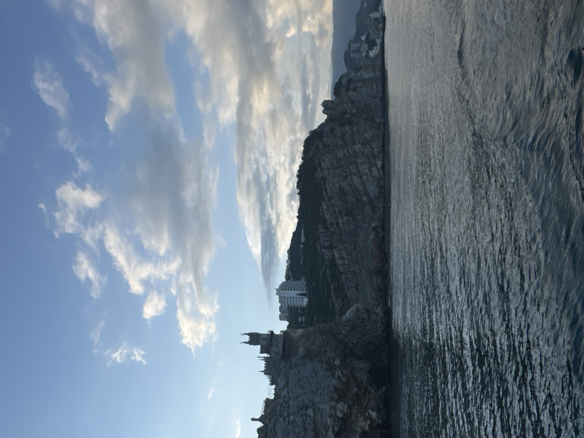 Tourists document Swallow's Nest castle amid construction activity in Gaspra