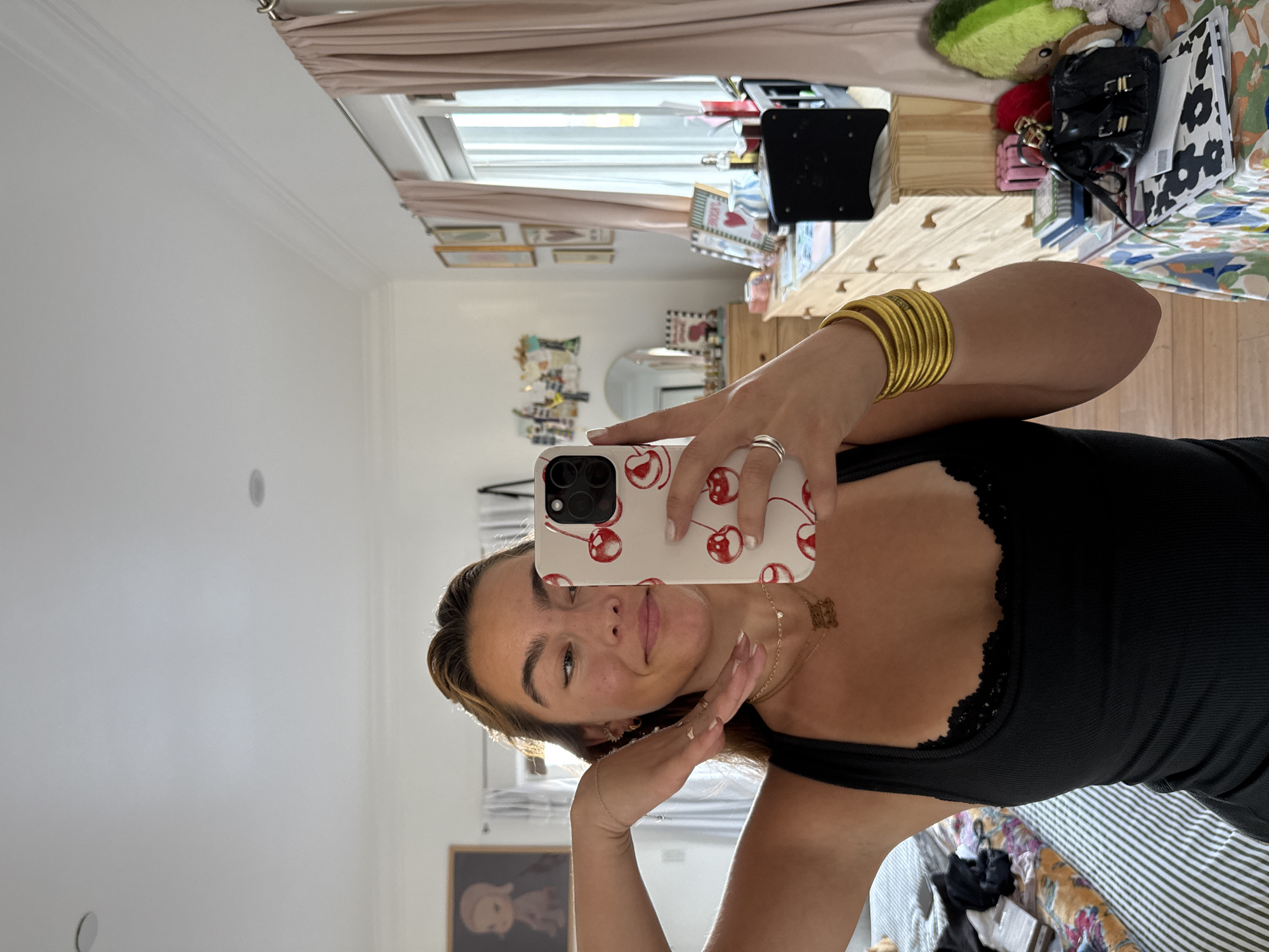 Woman takes mirror selfies with dachshund in LA bedroom