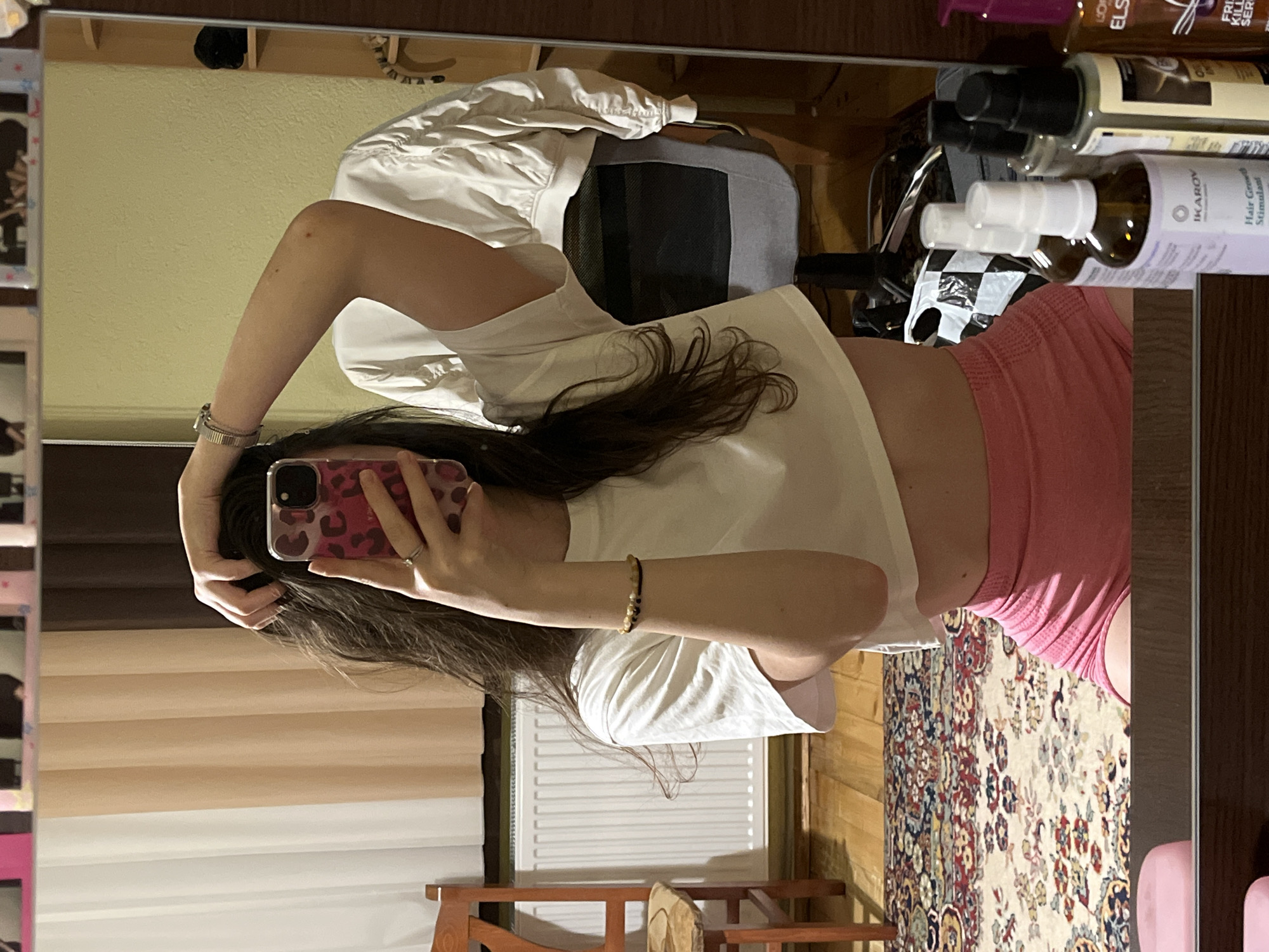Woman takes selfies indoors in Popintsi, Bulgaria