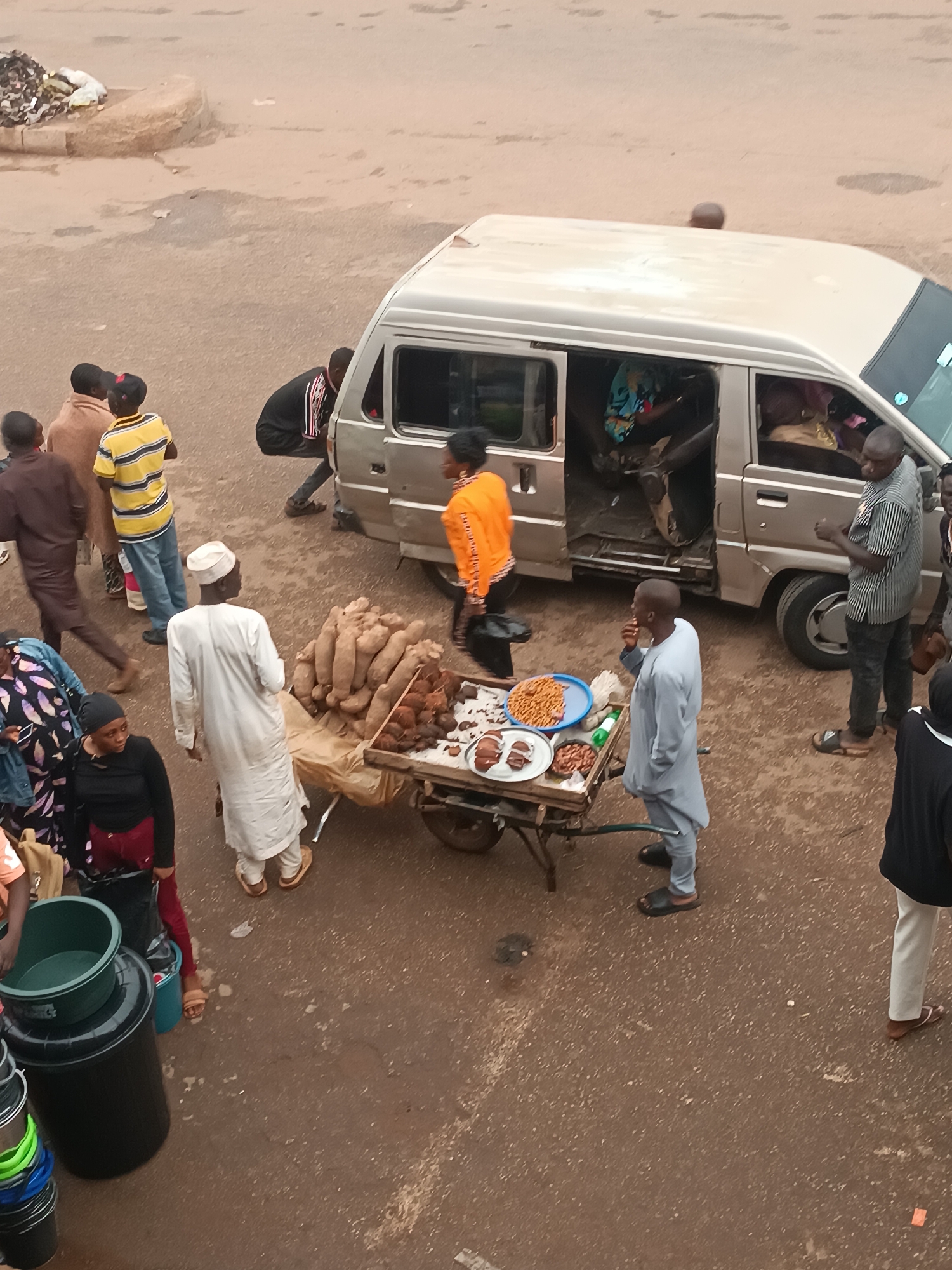 Afternoon street commerce and pedestrian activity captured in urban area