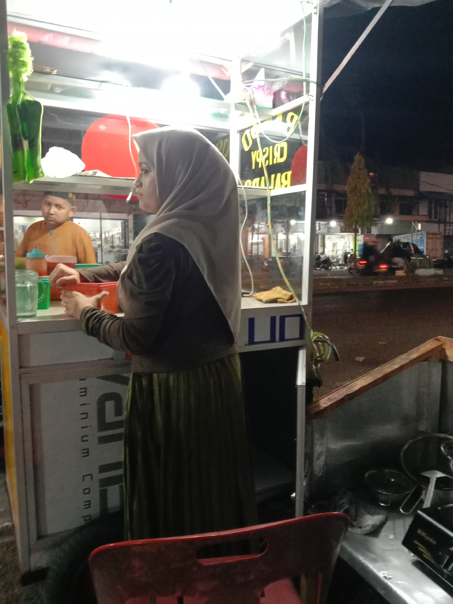 Woman visits street food cart near Hotel Grand Sydney
