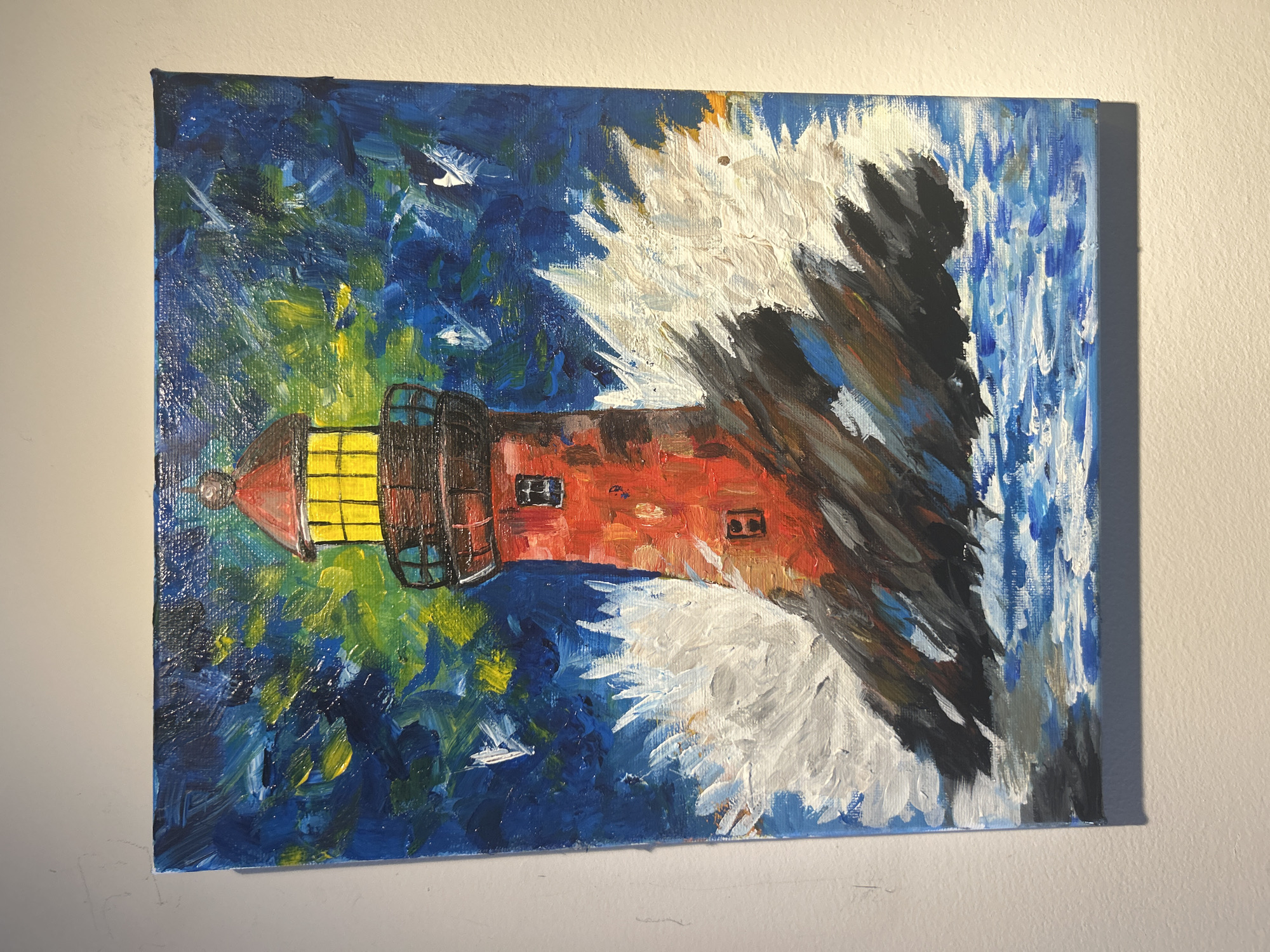 Lighthouse painting displayed on wall in Bansko, Bulgaria