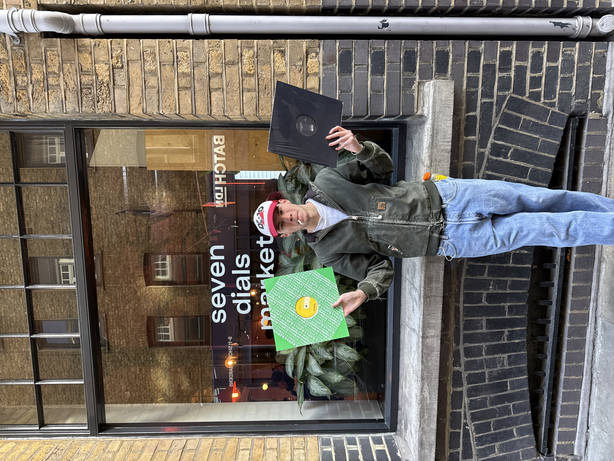 Person with vinyl records spotted outside London shop