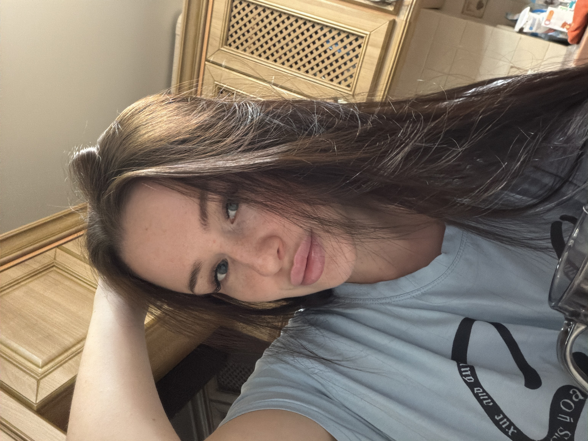 Young woman takes casual selfies indoors in Russia