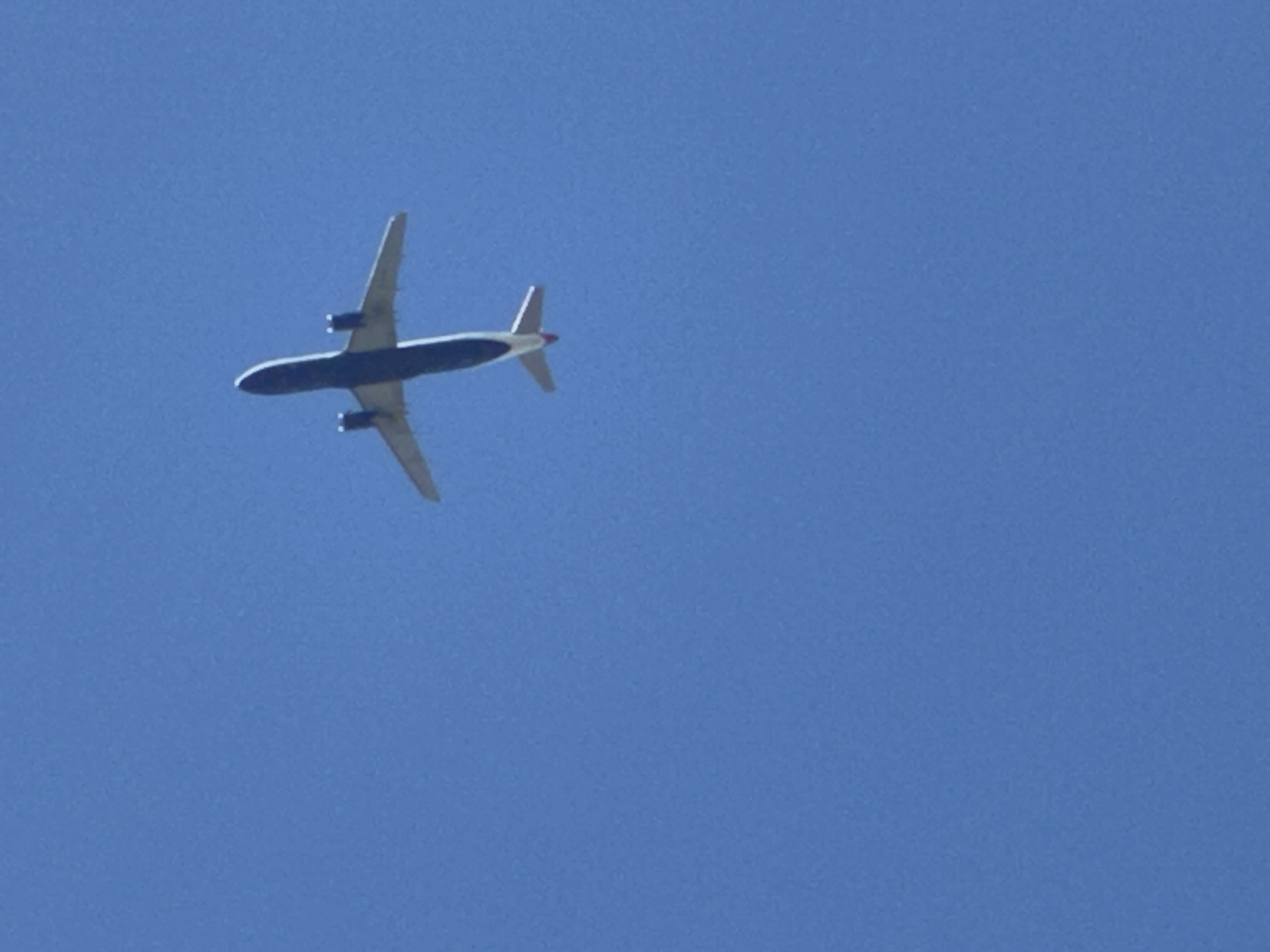 Commercial jets tracked across a clear south London sky