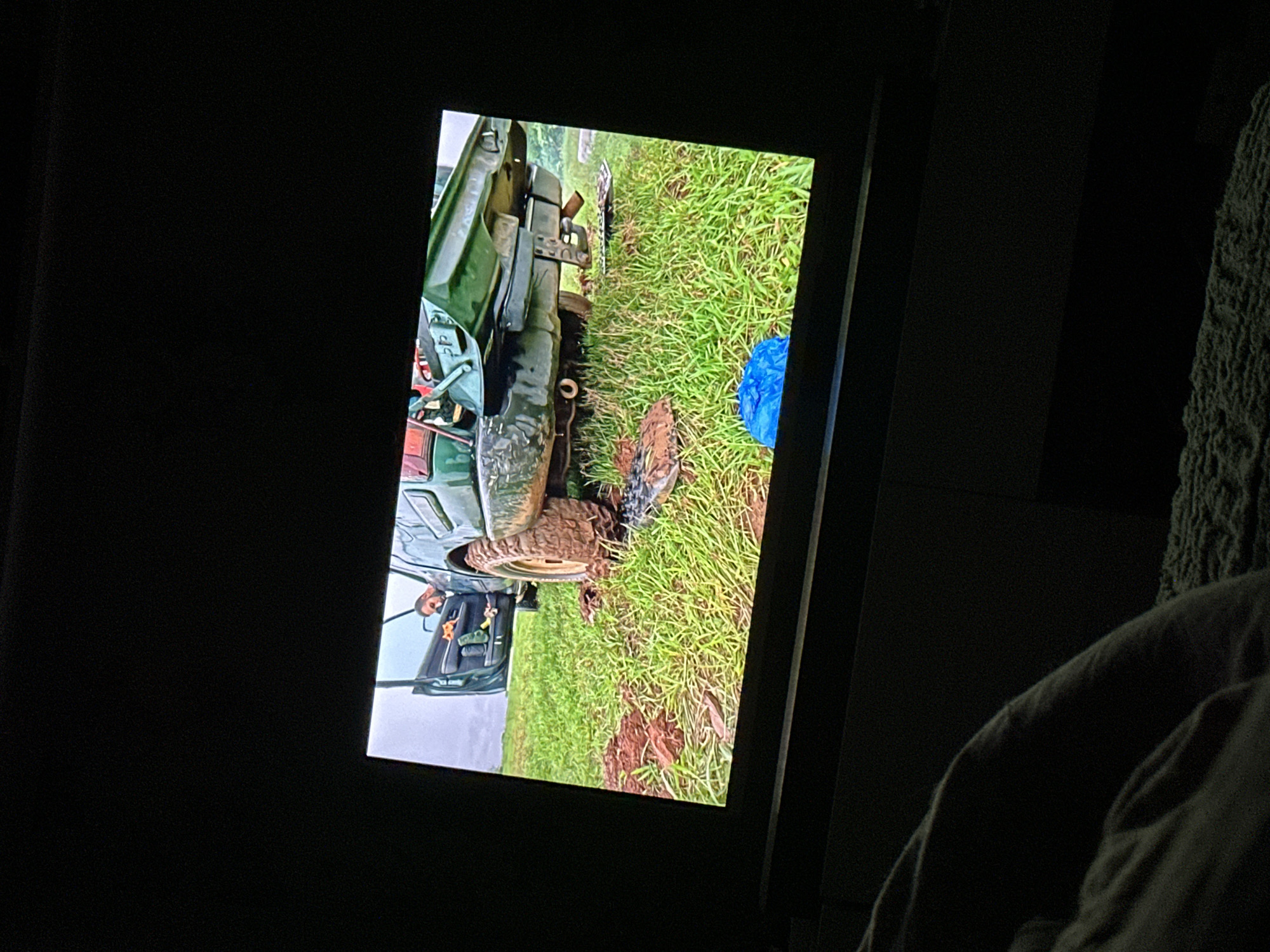 TV shows utility vehicle stuck in muddy field