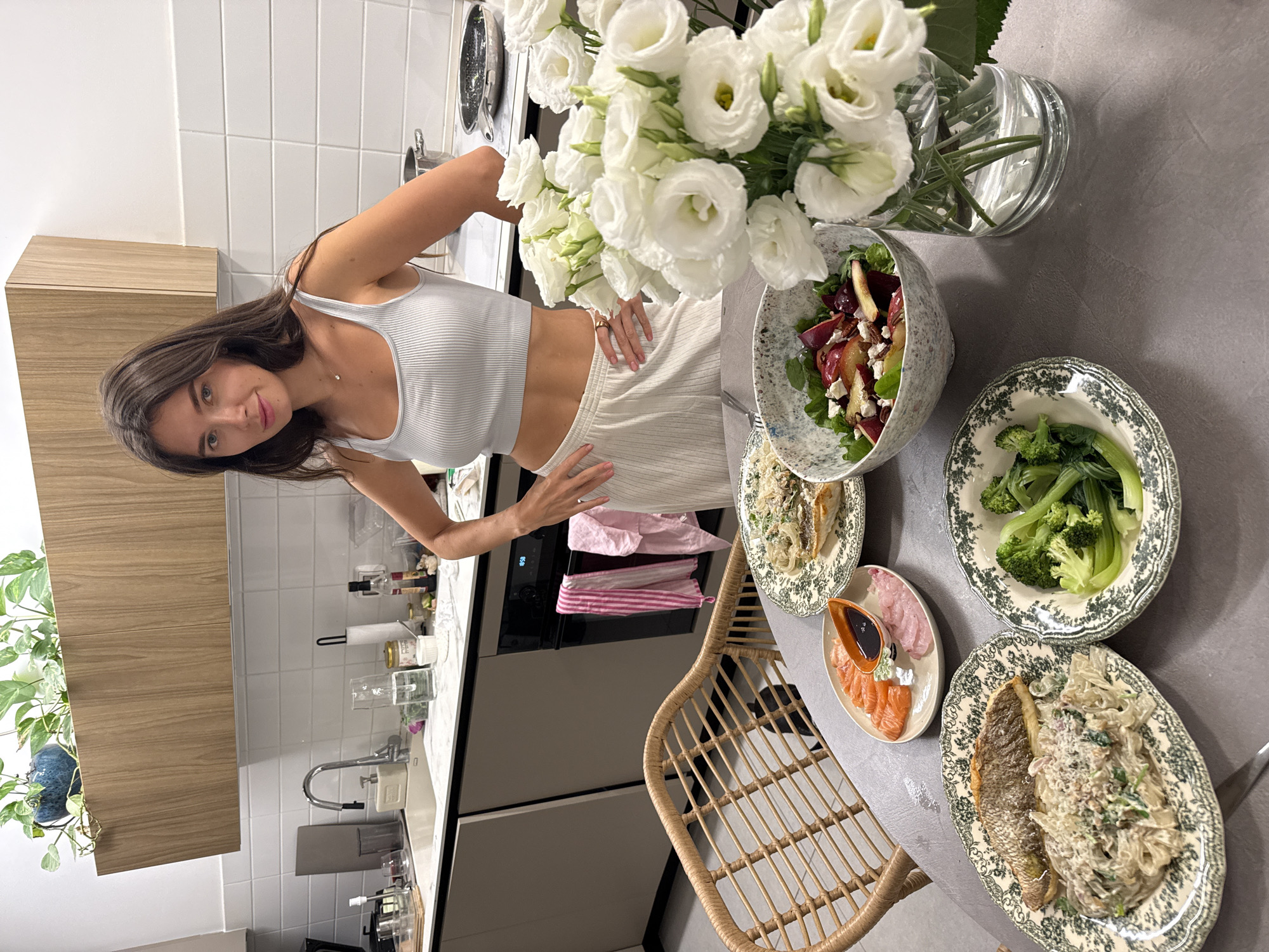 Woman poses in modern Tel Aviv kitchen