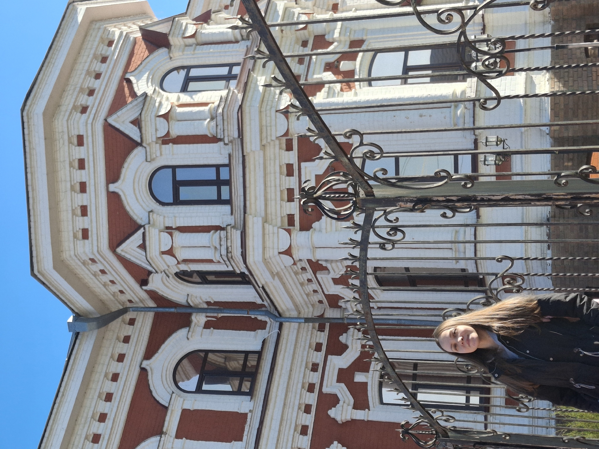 Woman photographed among historic buildings in Sarapul, Russia
