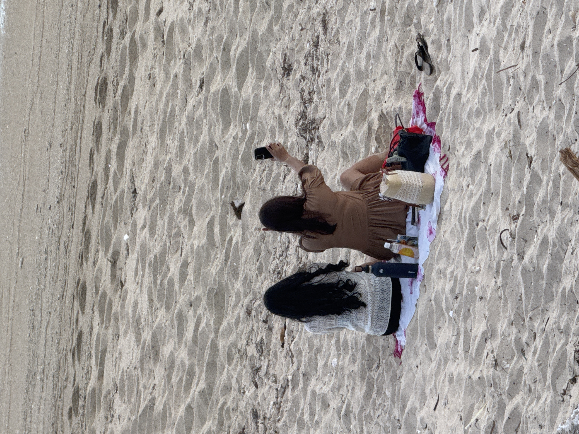 Beach day in Kuta Selatan: sand, surf, and a paraglider