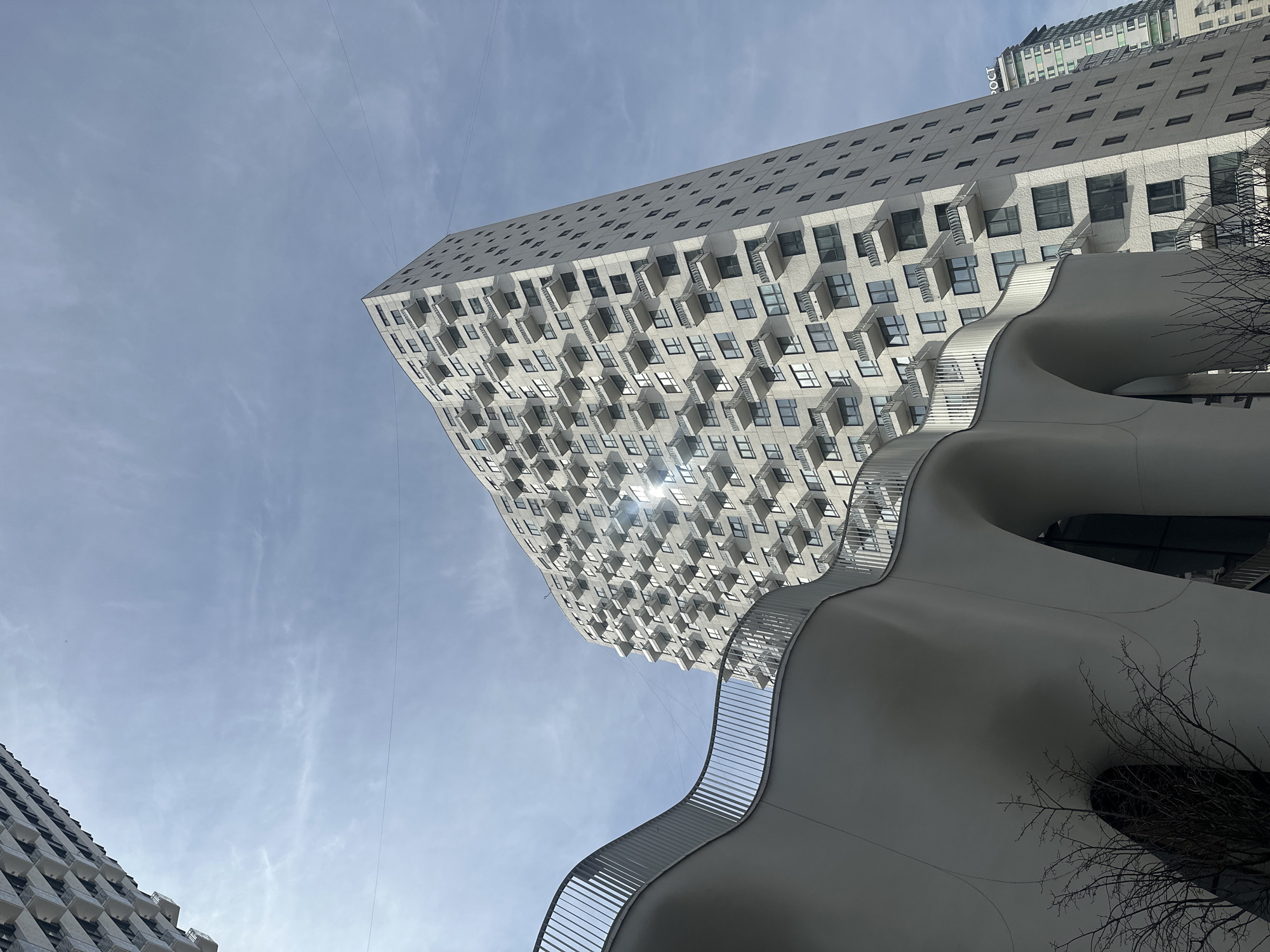 Morning sunlight illuminates geometric apartment buildings in Moscow