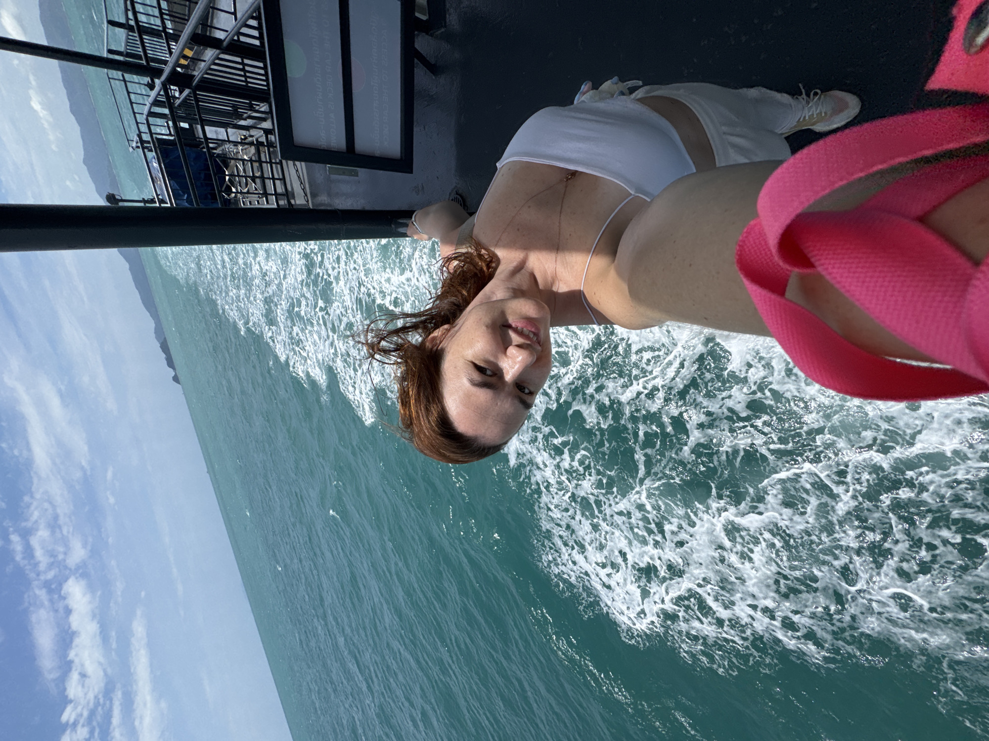 Ferry crossing Thai waters, selfies on deck, crew at work
