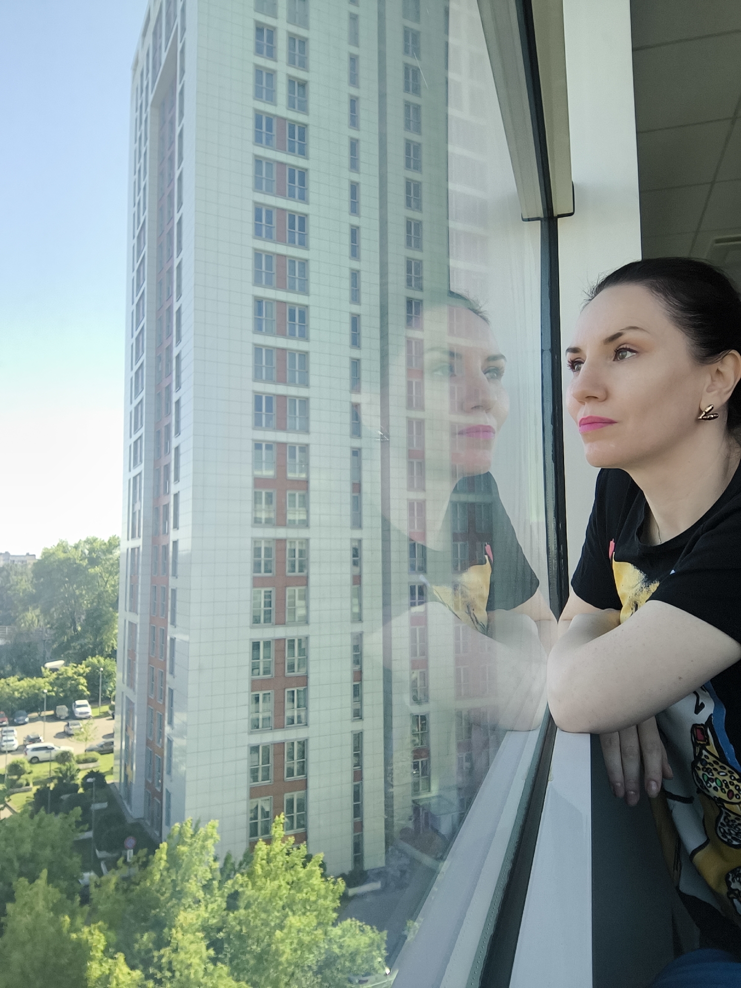 Woman observed in contemplative morning window gazing session