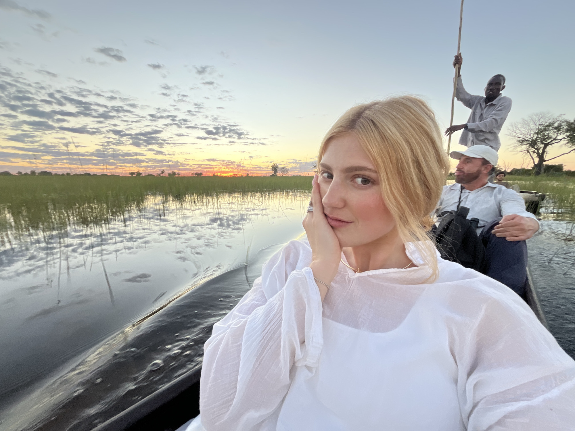Tourist group explores Botswana's Okavango Delta by boat
