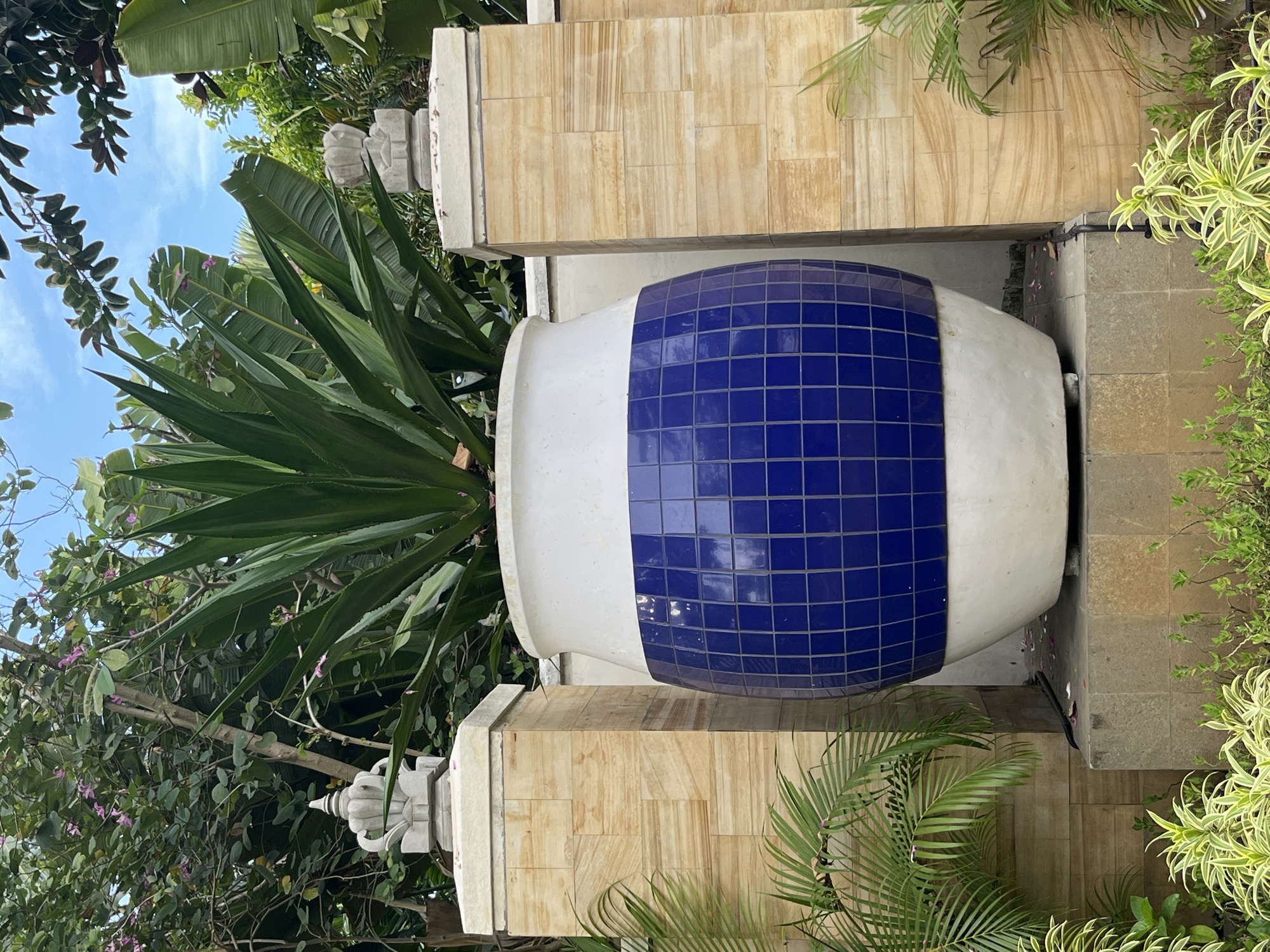 Hotel water gardens with lotus sculptures documented in Kuta Selatan