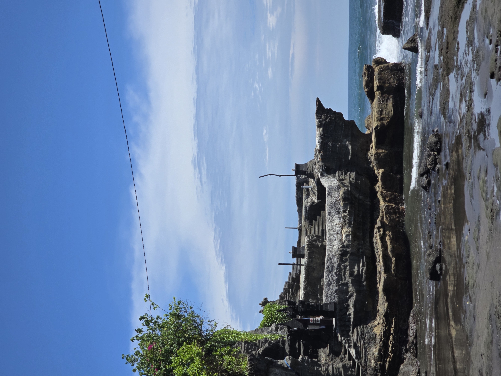 Ancient temple complex with guardian statues documented in Kediri